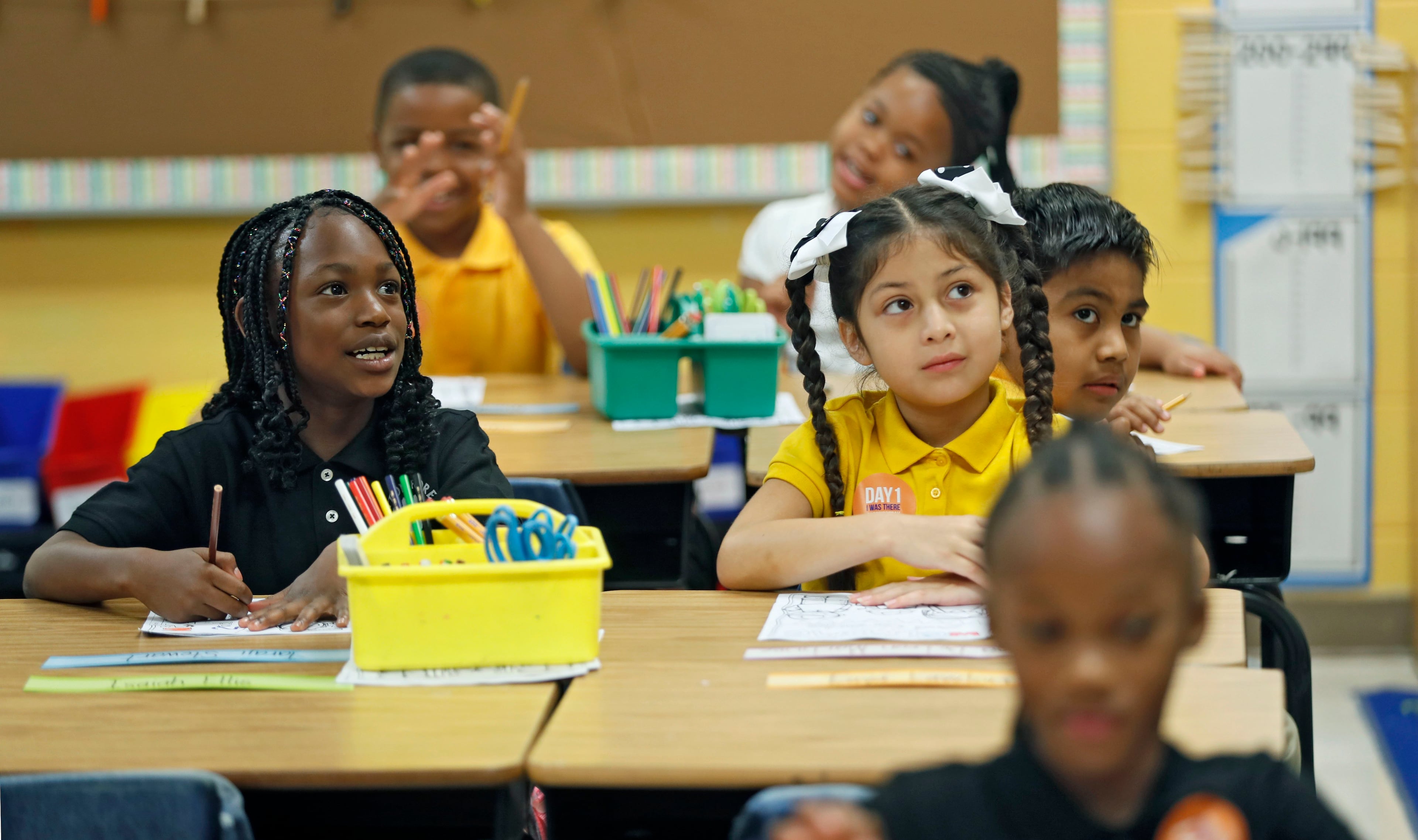 BACK TO SCHOOL (APS): Atlanta - Students are introduced to a math assignment in Hannah Reisman's second grade class. It was the first day of school at Peyton Forest Elementary school, which is celebrating its 50th anniversary. Teachers and staff welcomed the kids with a circus theme. BOB ANDRES /BANDRES@AJC.COM