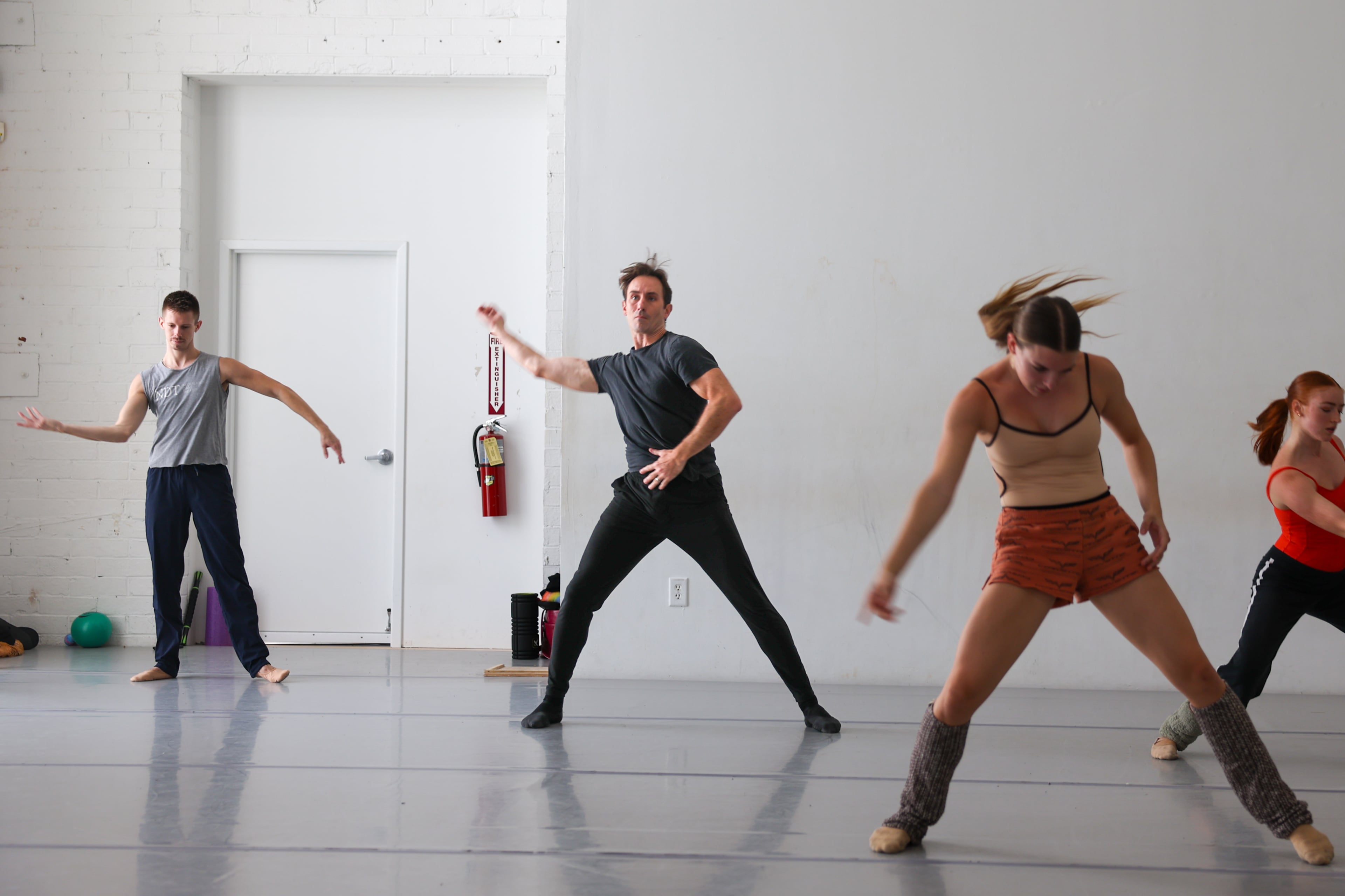 Clark (second from left) "gives his all in the studio, but he makes people laugh and keeps things light because it can get really intense in the room," said Terminus co-founder Rachel Van Buskirk. (Arvin Temkar/AJC)