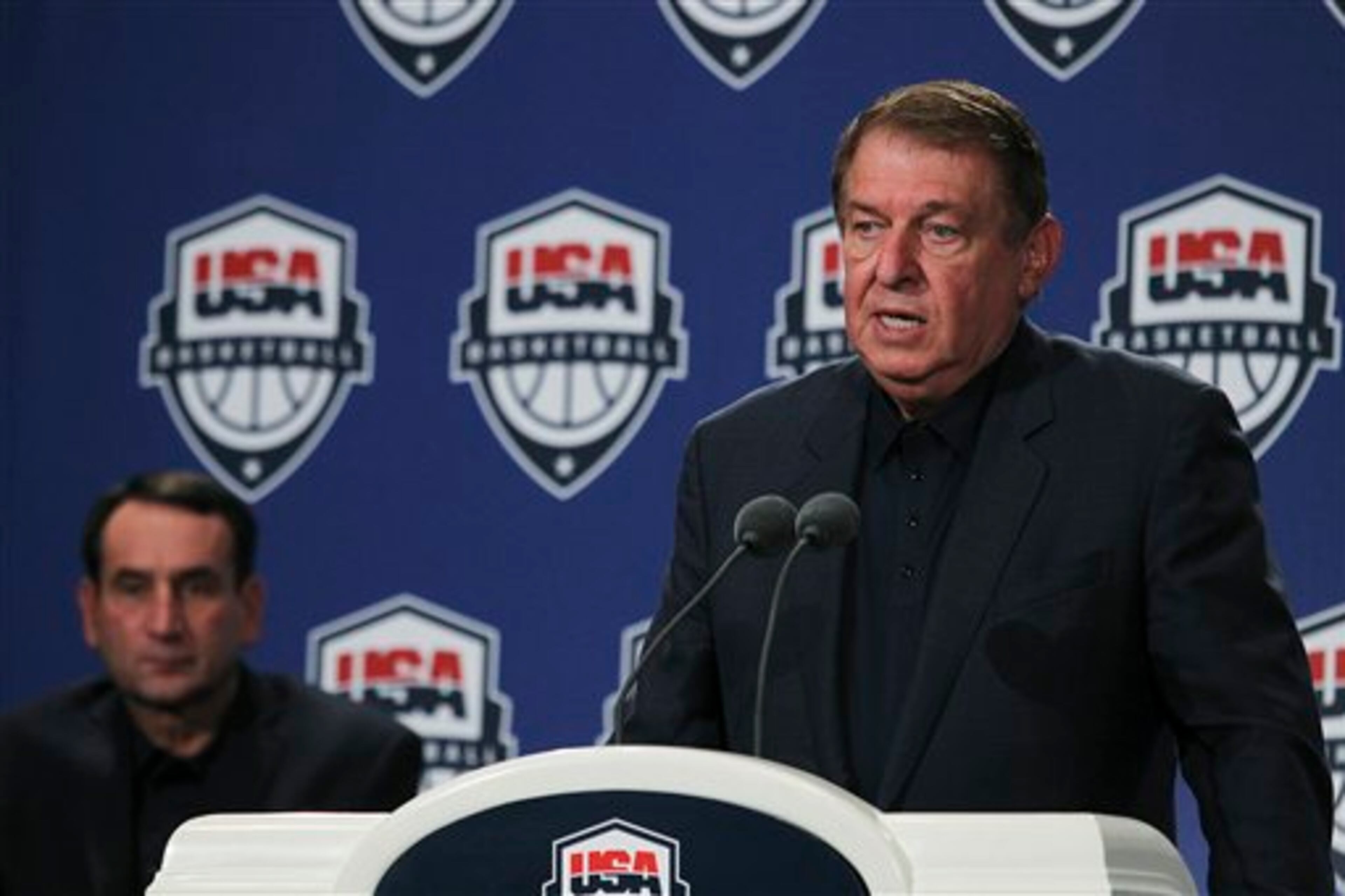 Managing Director Jerry Colangelo, right, speaks during the USA Basketball men's team news conference announcing the final roster in Las Vegas on Saturday, July 7, 2012. Coach Mike Krzyzewski is seated at left. (AP Photo/Las Vegas Review-Journal, Jason Bean)