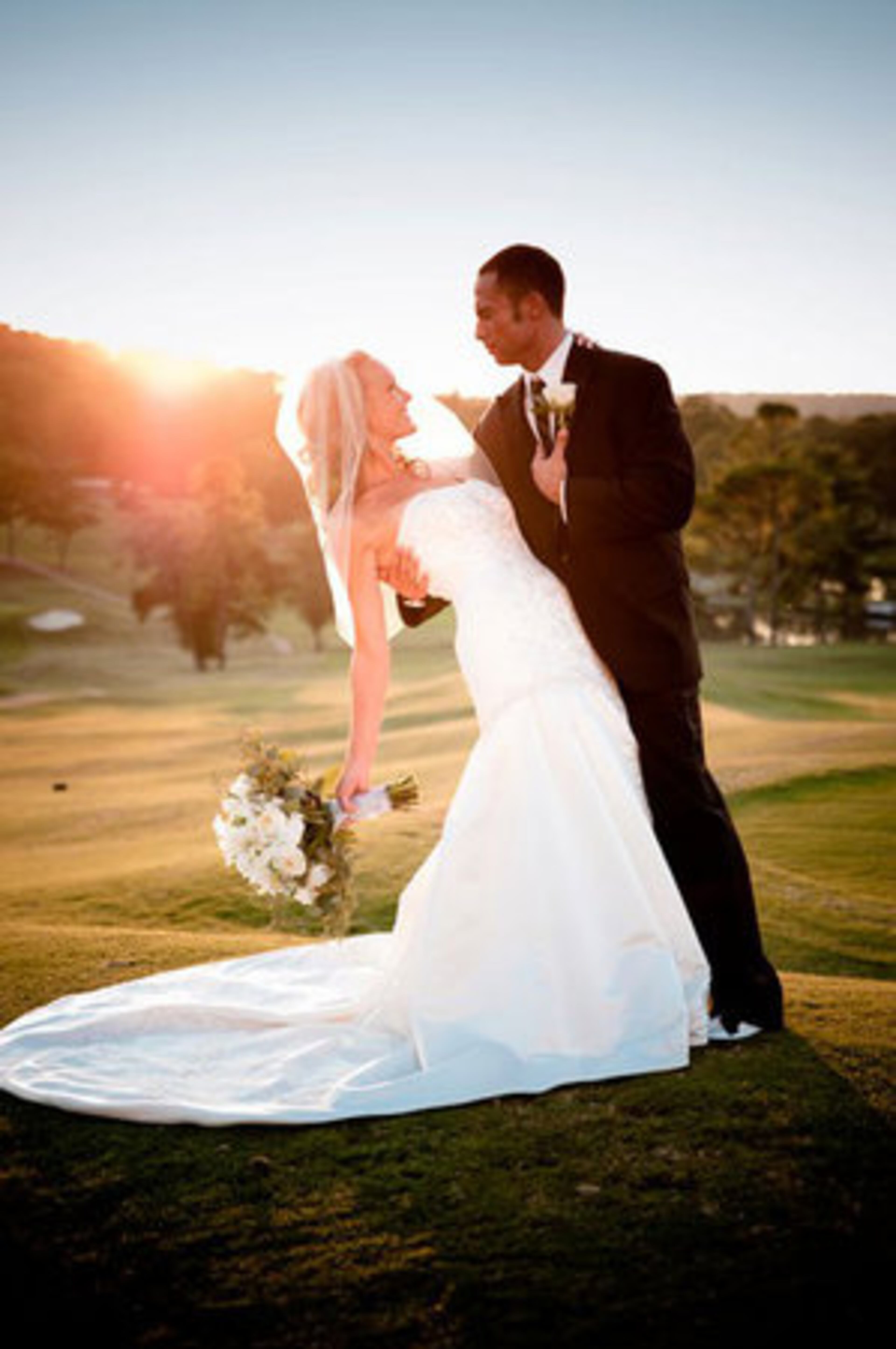 Erica Davidson and her husband posed for a photo as the sun went down on their wedding date, Oct. 10, 2010.