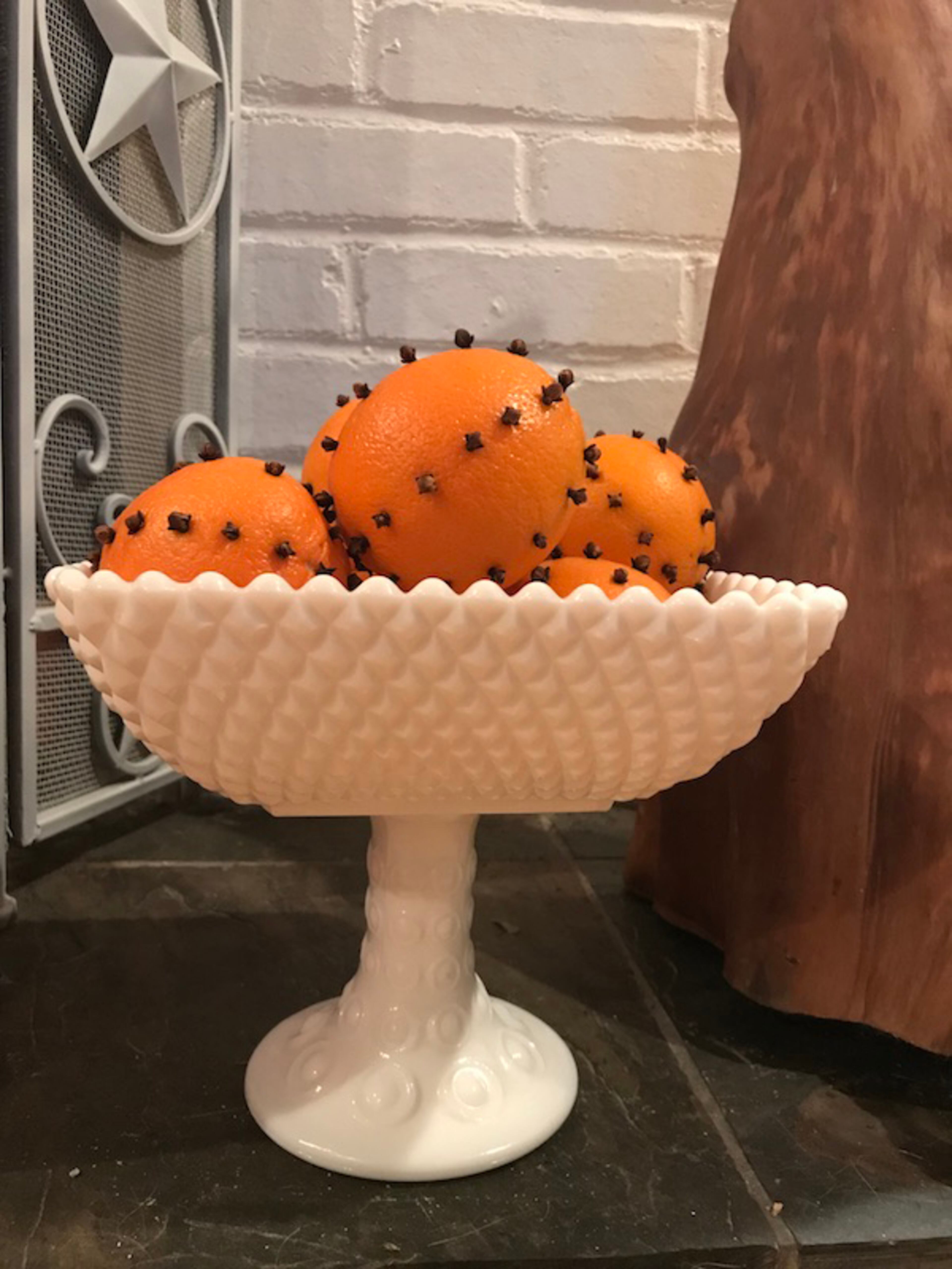 Orange pomanders are as pretty as they are fragrant when piled high as a centerpiece. Julia Skinner for The Atlanta Journal-Constitution