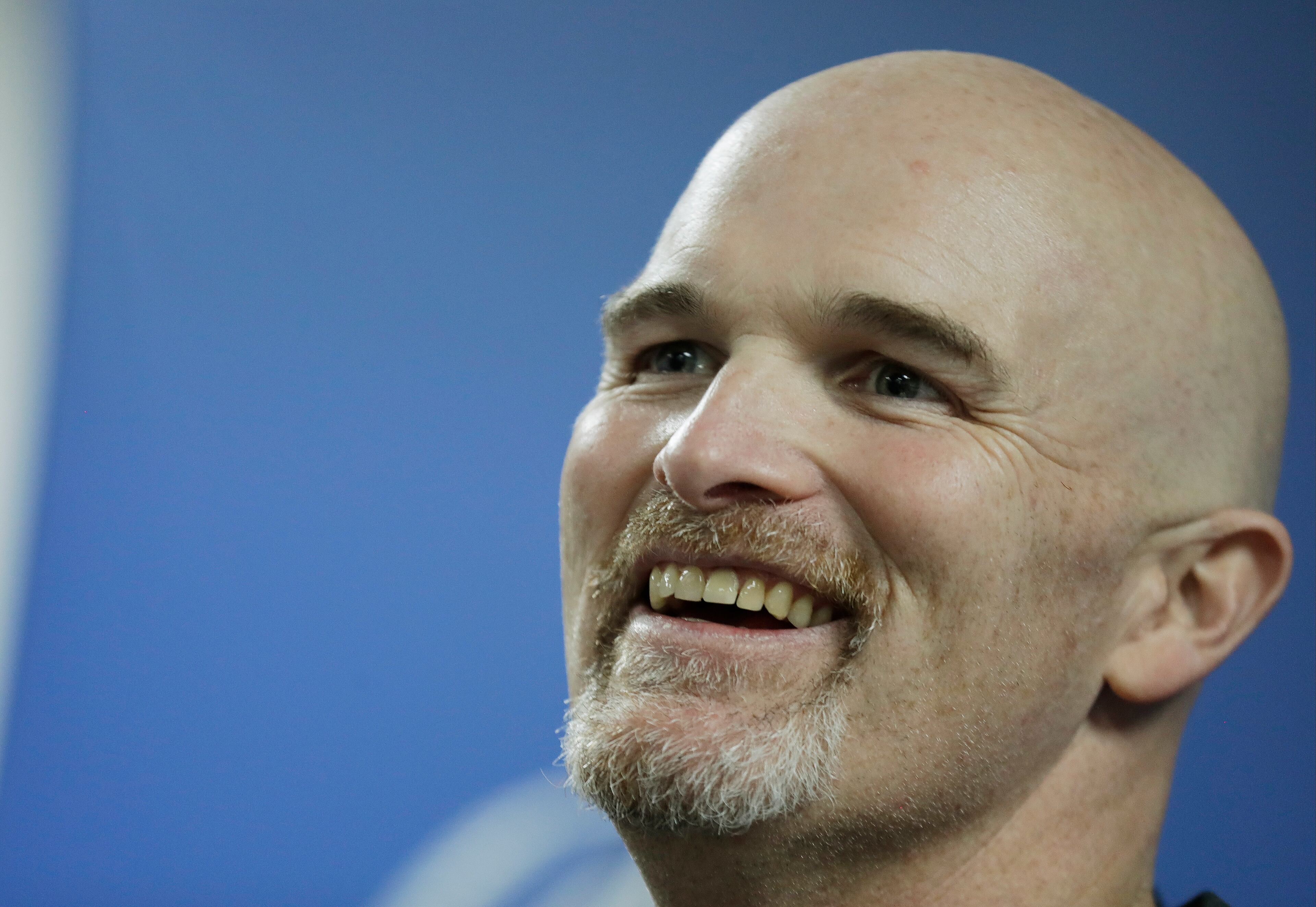 Atlanta Falcons head coach Dan Quinn smiles as he answers questions after the NFL football NFC championship game against the Green Bay Packers Sunday, Jan. 22, 2017, in Atlanta. The Falcons won 44-21 to advance to Super Bowl LI. (AP Photo/David Goldman)