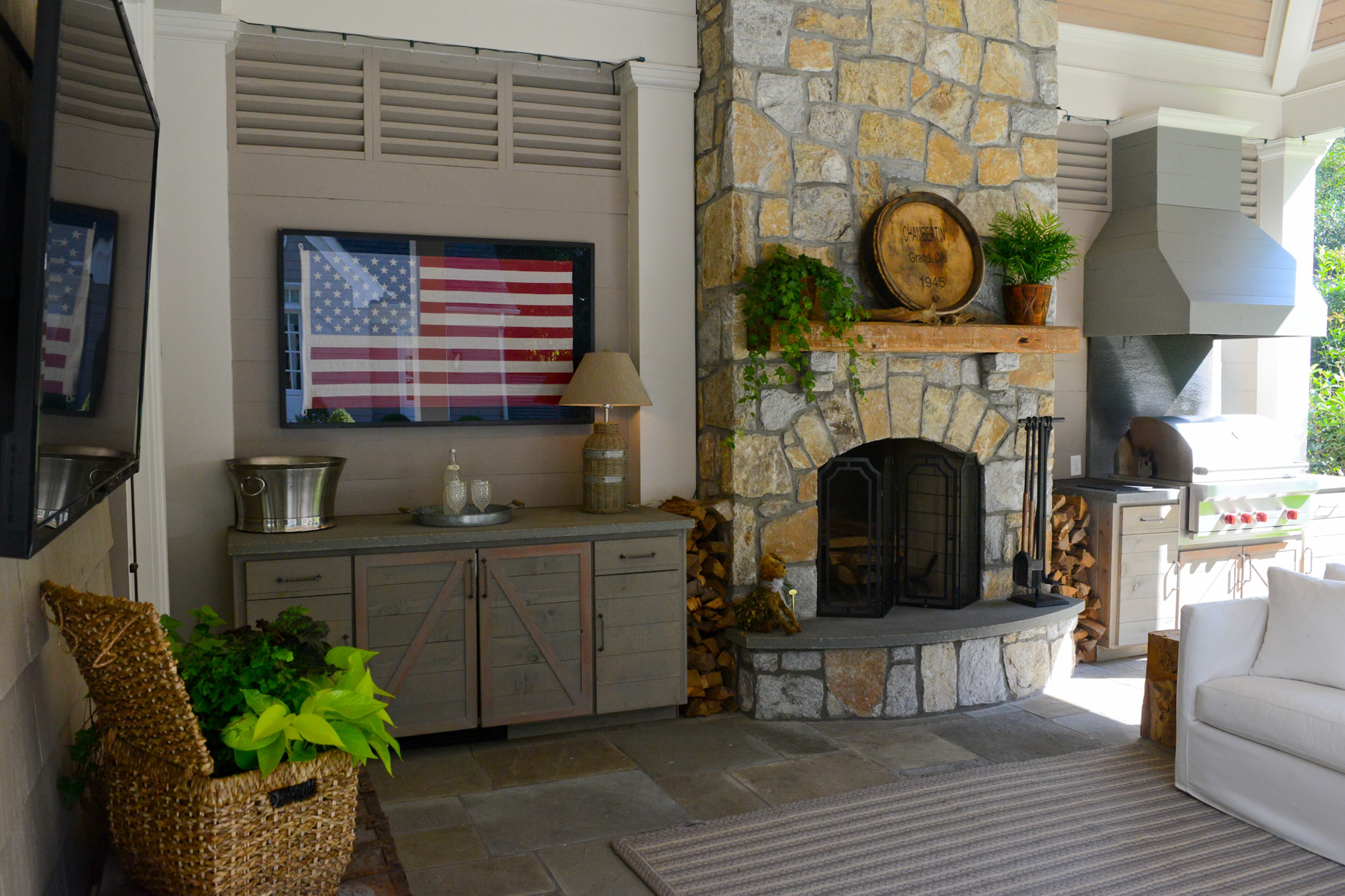 Just off the family room in David and Jamie Dean's home is a covered porch designed for entertaining. "We have a big fireplace," says Jamie. "We love to sit out there and entertain."