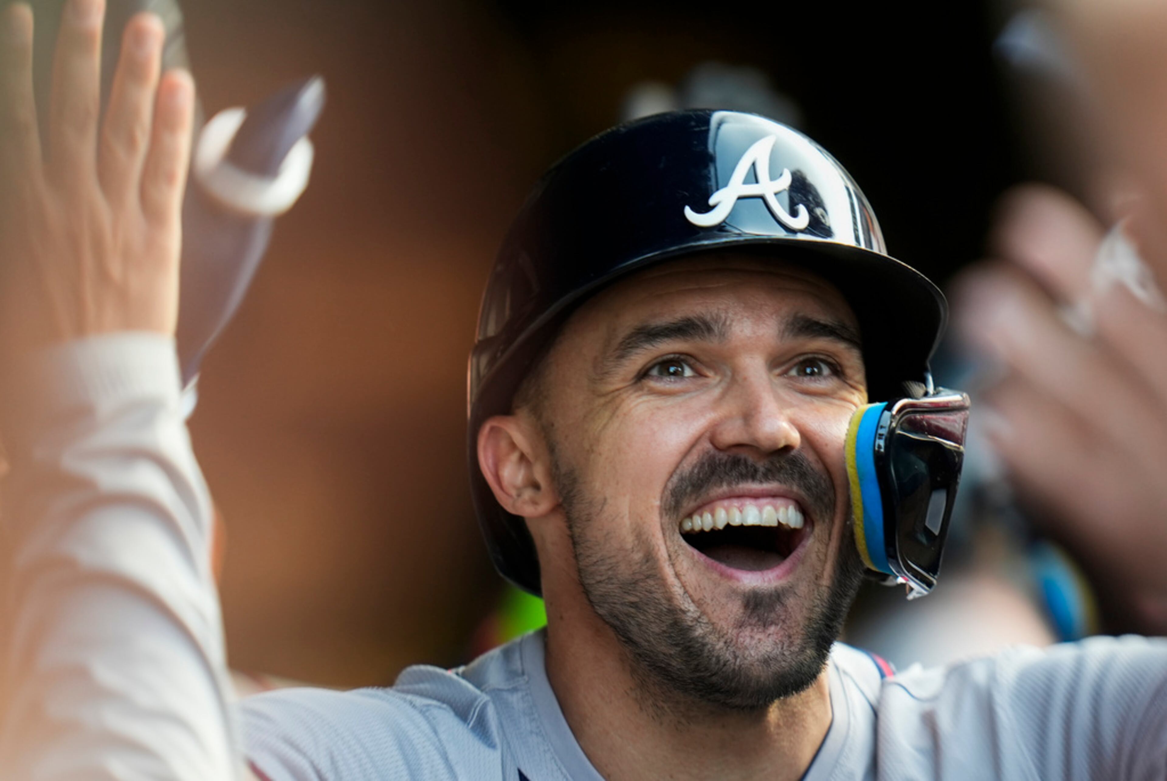Atlanta Braves' Adam Duvall celebrates after hitting a home run during the third inning of a baseball game against the Chicago Cubs, Wednesday, May 22, 2024, in Chicago. The Braves won 9-2. (AP Photo/Erin Hooley)