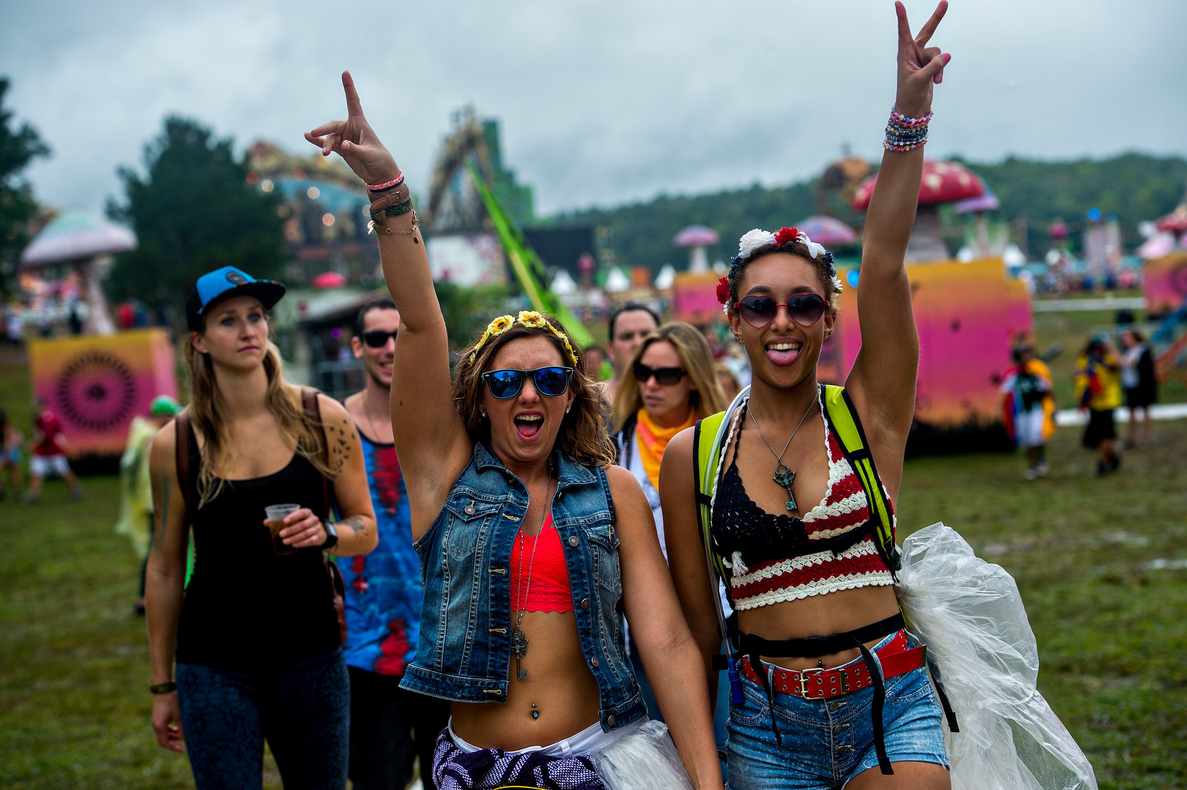 Alix Kaiser (left) walks with Rika Thibodeaux as they make their way to their next stage during TomorrowWorld in Chattahoochee Hills on Saturday, September 26, 2015. The three day electronic music festival brought in close to 160,000 people to see deejays such as Tiesto, Afrojack, Paul van Dyk, Armin Van Buuren and more. JONATHAN PHILLIPS / SPECIAL
