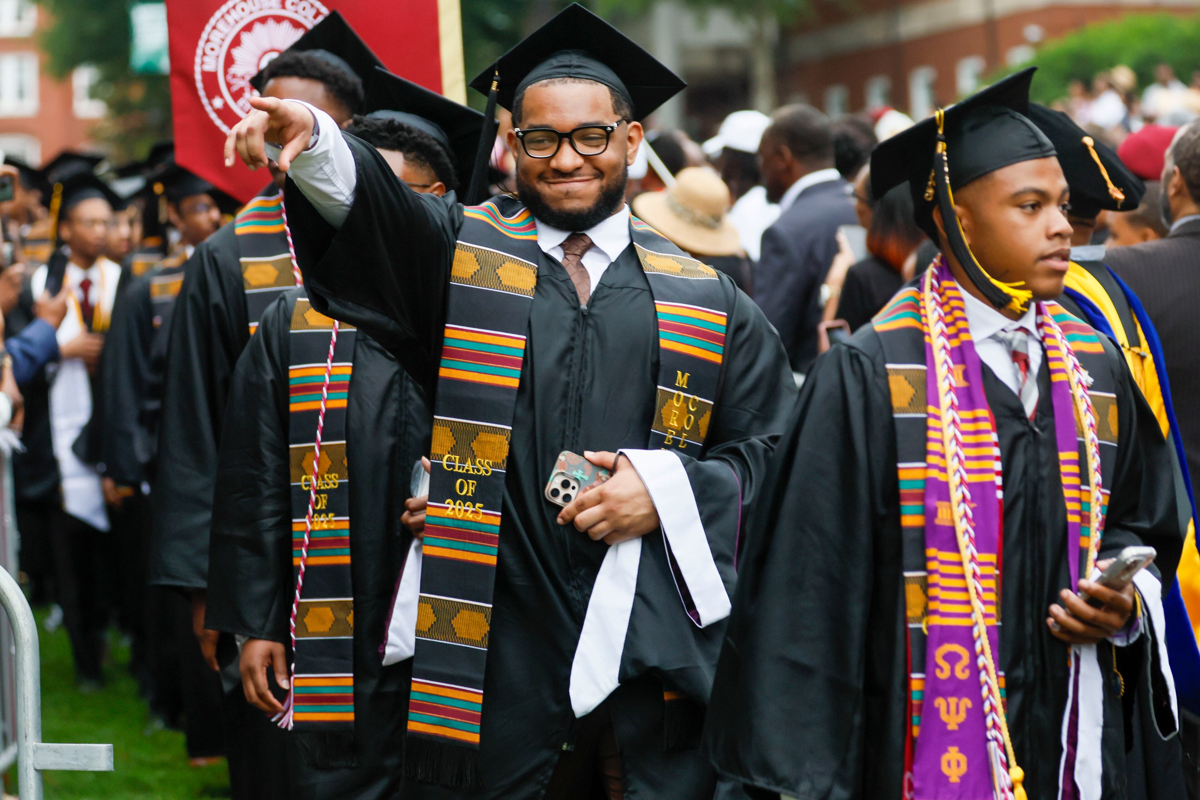 A graduate reacts to family members as he enters the ceremony during Morehouse College's 141st Commencement Ceremony on Sunday, May 18, 2025.
(Miguel Martinez/ AJC)