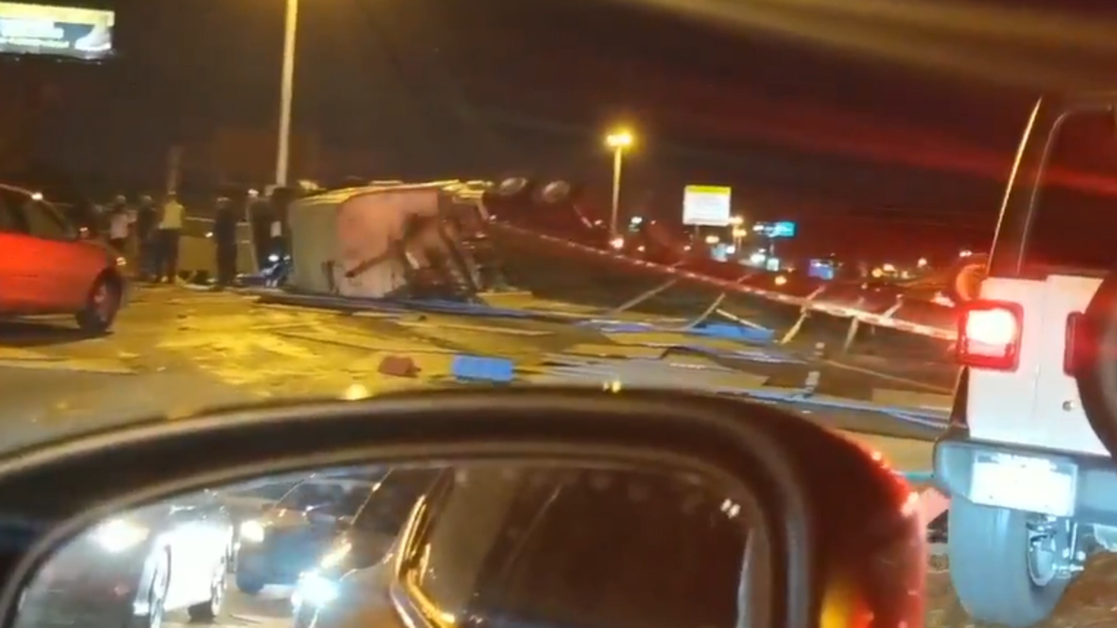 This is a screenshot of video a witness provided to Channel 2 Action News of the overturned tractor-trailer.