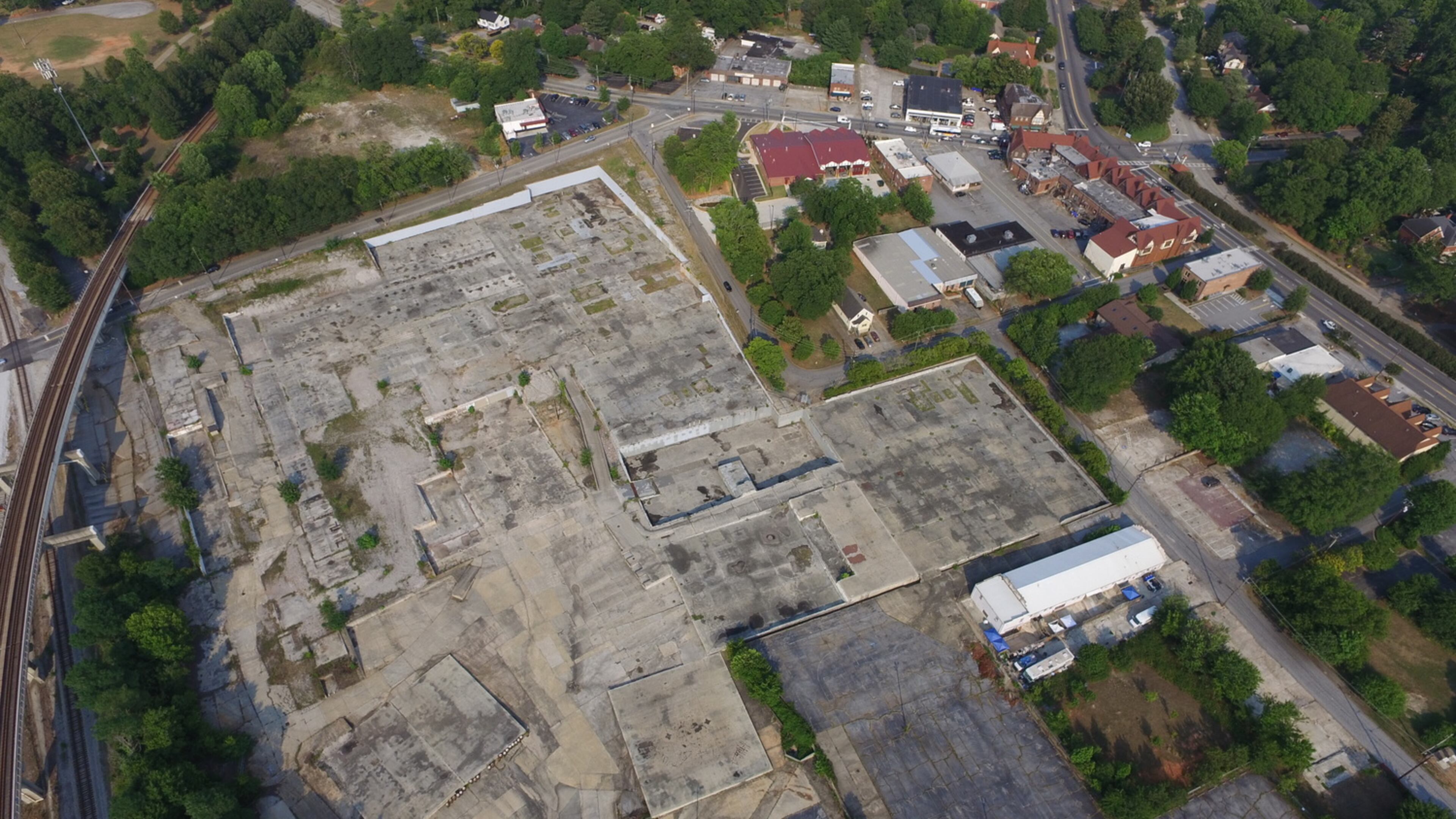 This is the 13-acres of concrete owned by Avila Real Estate that will change Avondale Estates significantly when it’s finally developed. The city-owned five acres is partially shown in the lower right of this photo, mostly marked by tree tops. Courtesy of Avila Real Estate.