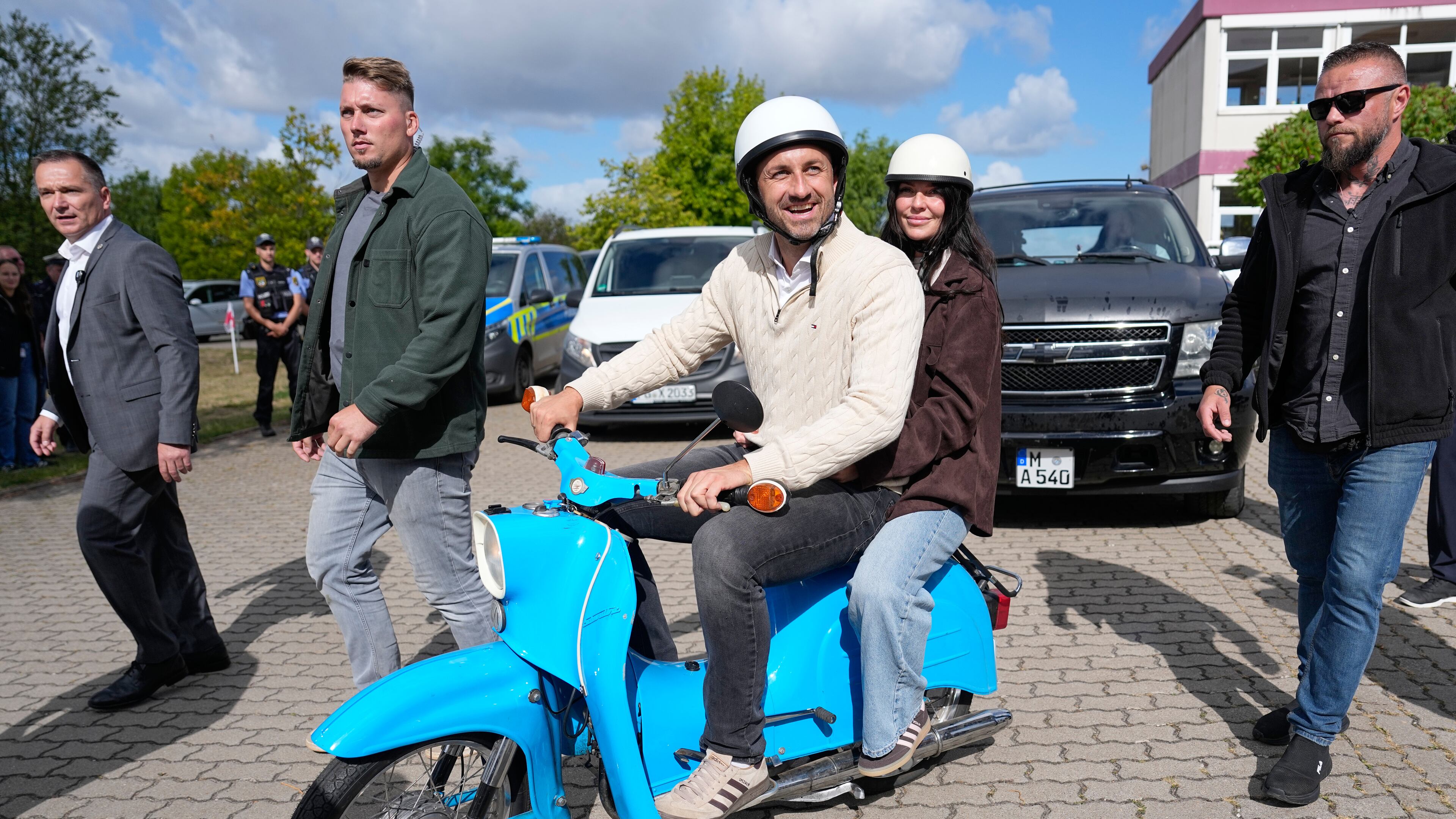Ulrich Siegmund, top candidate for the "Alternative for Germany" (AfD) party and his wife Julia leaving a polling station on a small Schwalbe motorcycle after voting during the Saxony-Anhalt state elections in Tangermuende, eastern Germany, Sunday, Sept. 6, 2026. (AP Photo/Matthias Schrader)