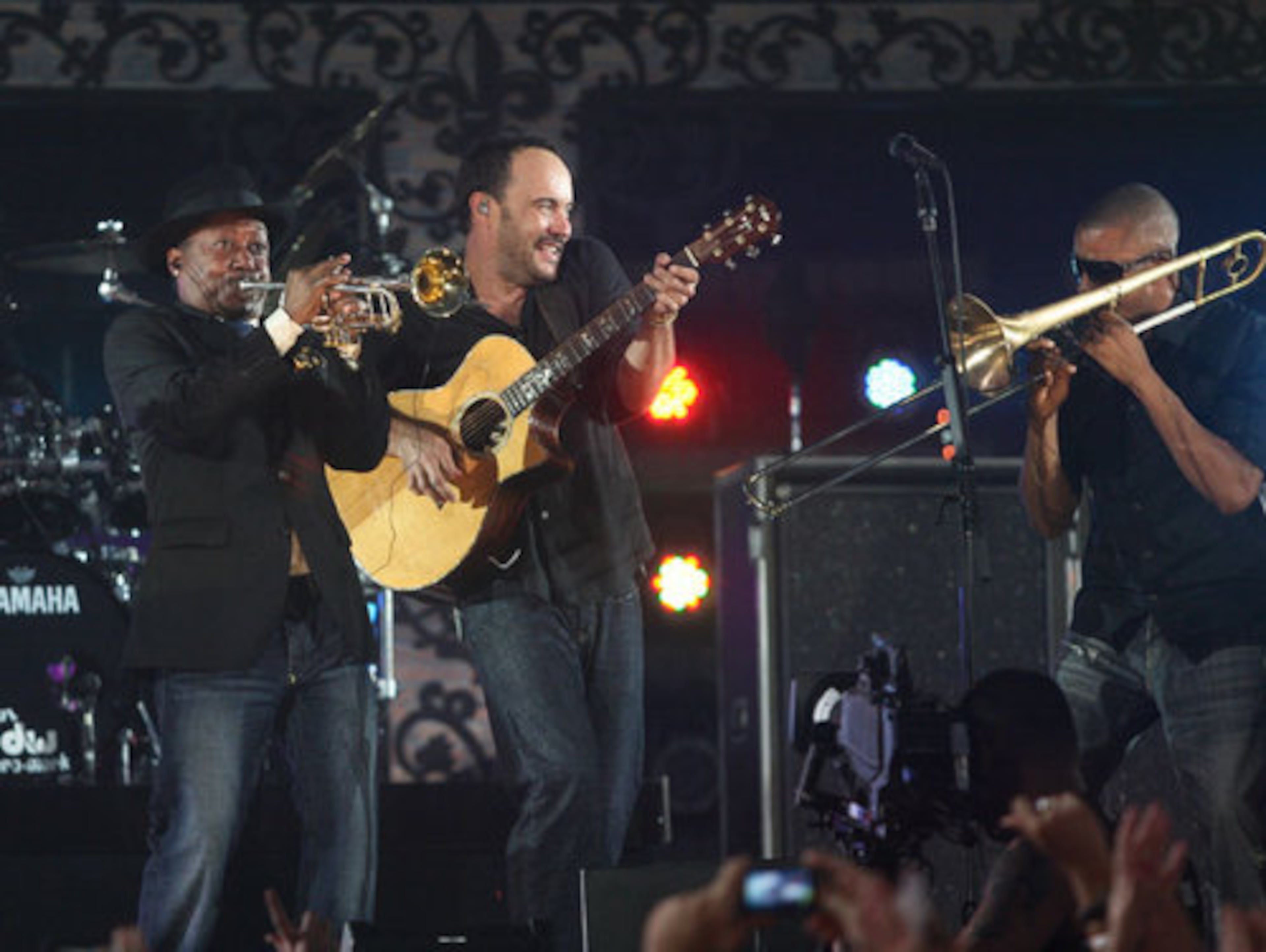 Kermit Ruffins (left) and Trombone Shorty (right) perform on stage with Dave Matthews.