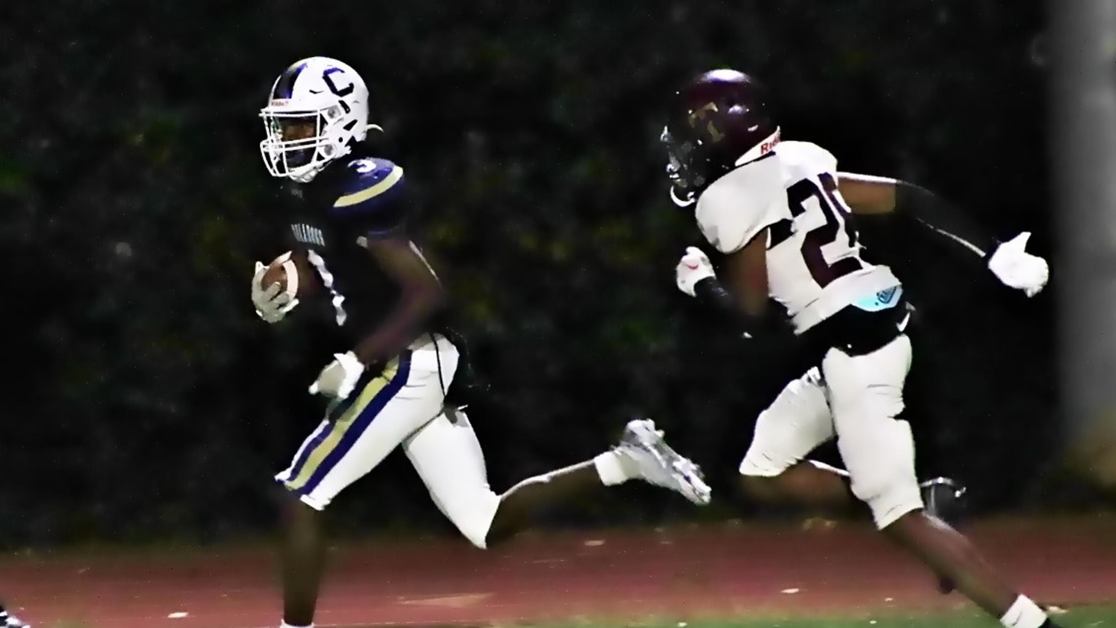 Chamblee’s Larry Harris outraces Tucker’s Tewroh Sungbeh into the end zone for a 32-yard touchdown in the Bulldogs' 15-10 victory at North DeKalb Stadium on Oct. 6, 2022. (Photo by Mark Brock)