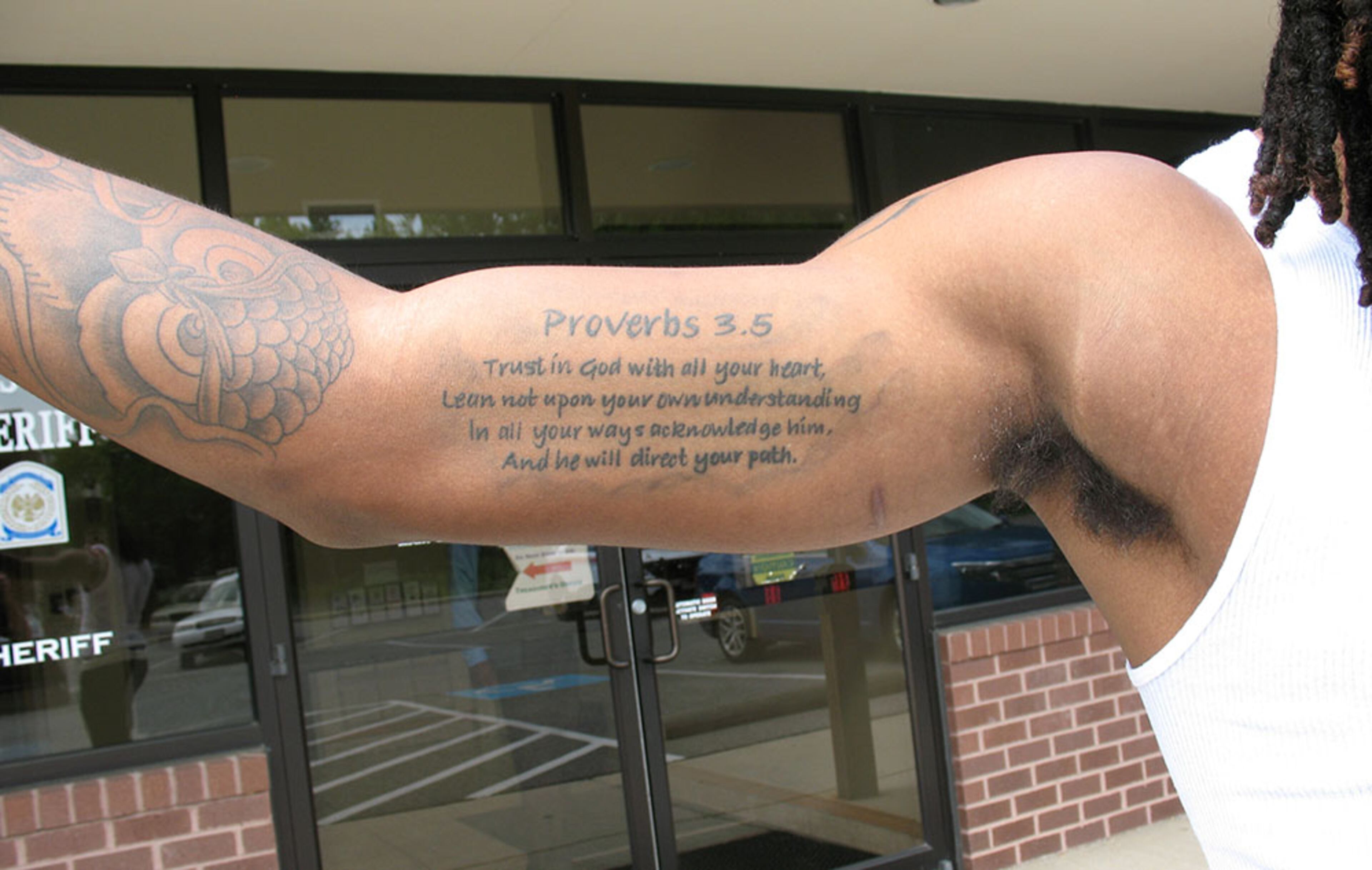 Juwuan Briscoe is a Christian believer, as the tattoo on his right bicep attests. It's a translation of Proverbs 3:5. "Trust in God with all your heart. Lean not upon your own understanding. In all your way acknowledge Him and He will direct your path." (AJC / CHIP TOWERS)