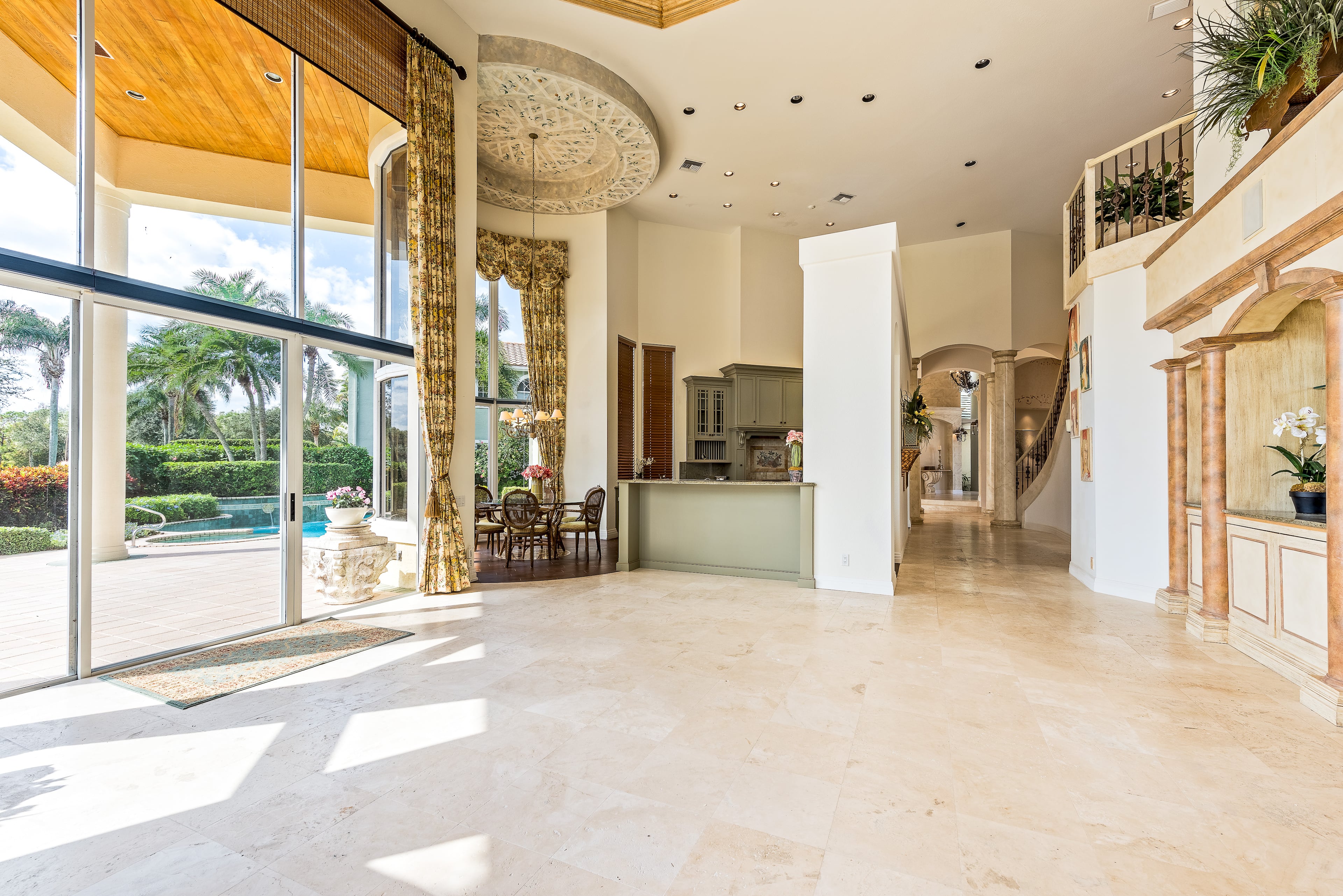 Former GOP presidential hopeful and the future HUD secretary Ben Carson has listed his golf-club community home in Palm Beach, Fla. for $1.2 million. The two-story residence has soaring floor-to-ceiling windows that wonderfully blend the the outside tropical paradise with the interior living spaces. This five bedroom, 6000 ft., and 4.5 bathroom is a mini-mansion that comes with marble floors, custom built-in's throughout, remote operated window coverings along with a tastefully upgraded chefs kitchen. (Listing courtesy ENGEL & VOLKERS Palm Beach)