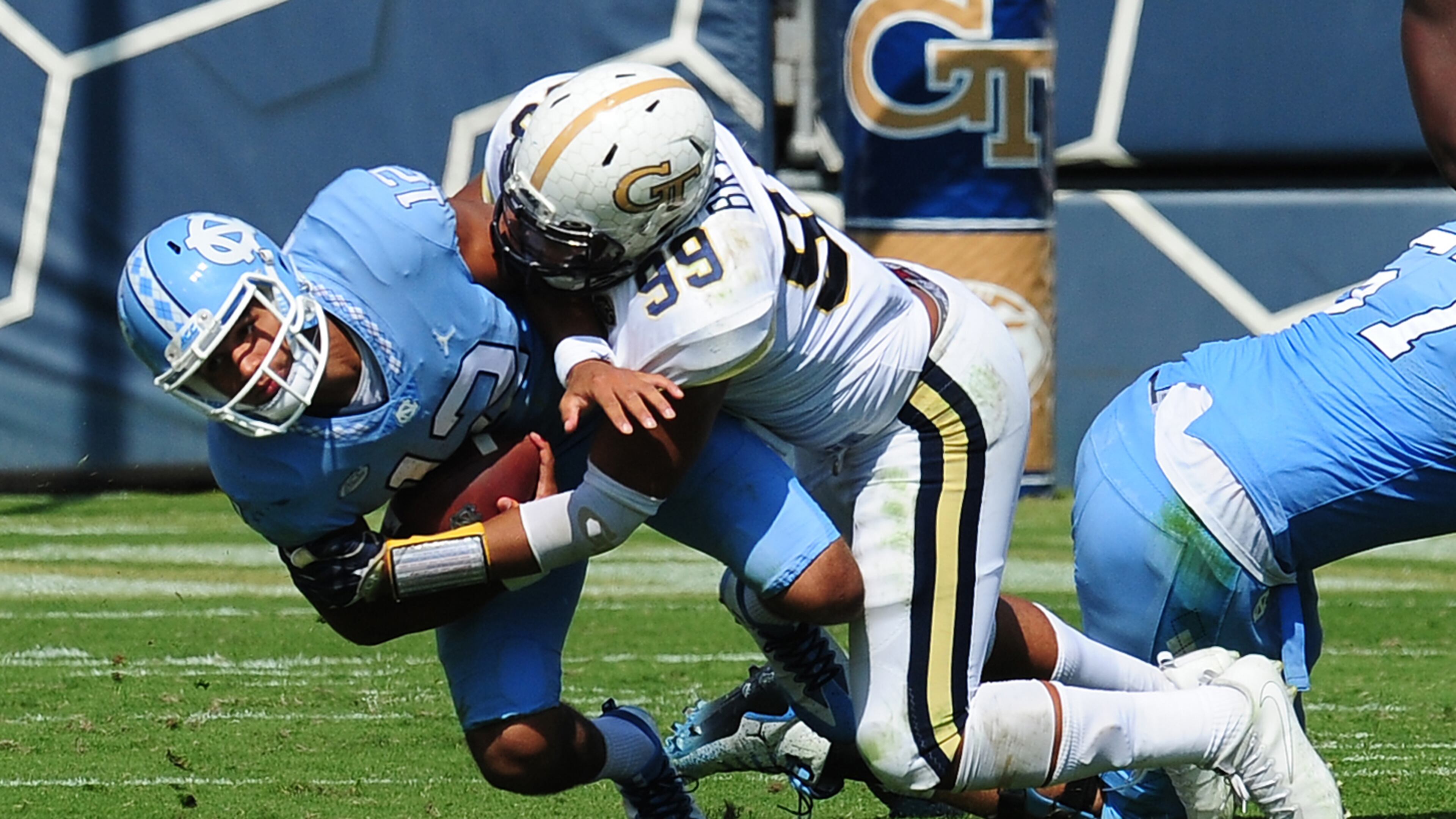 ATLANTA, GA - SEPTEMBER 30: Chazz Surratt #12 of the North Carolina Tar Heels is sacked by Desmond Branch #99 of the Georgia Tech Yellow Jackets on September 30, 2017 in Atlanta, Georgia. Photo by Scott Cunningham/Getty Images)