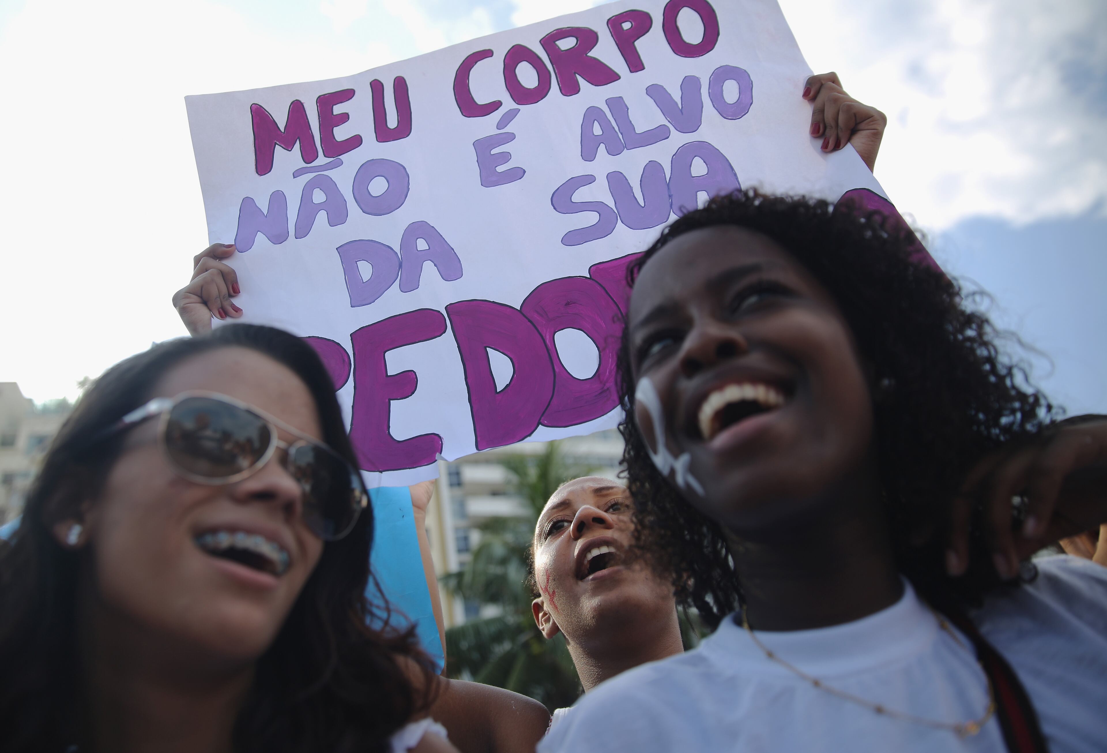 RIO DE JANEIRO, BRAZIL - MARCH 08: Women chant during a march marking International Women's Day on March 8, 2015 in Rio de Janeiro, Brazil. Marches and events were held worldwide to support gender equality and women who battle gender-based violence. (Photo by Mario Tama/Getty Images)