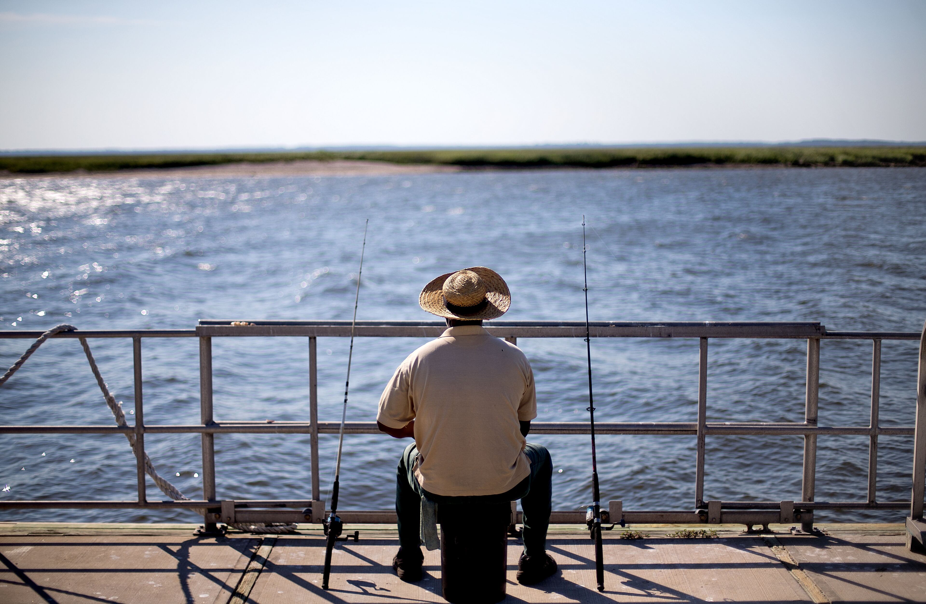 Sapelo Island, Ga. resident, Kent Grovner, fishes off a dock on Wednesday, May 15, 2013.