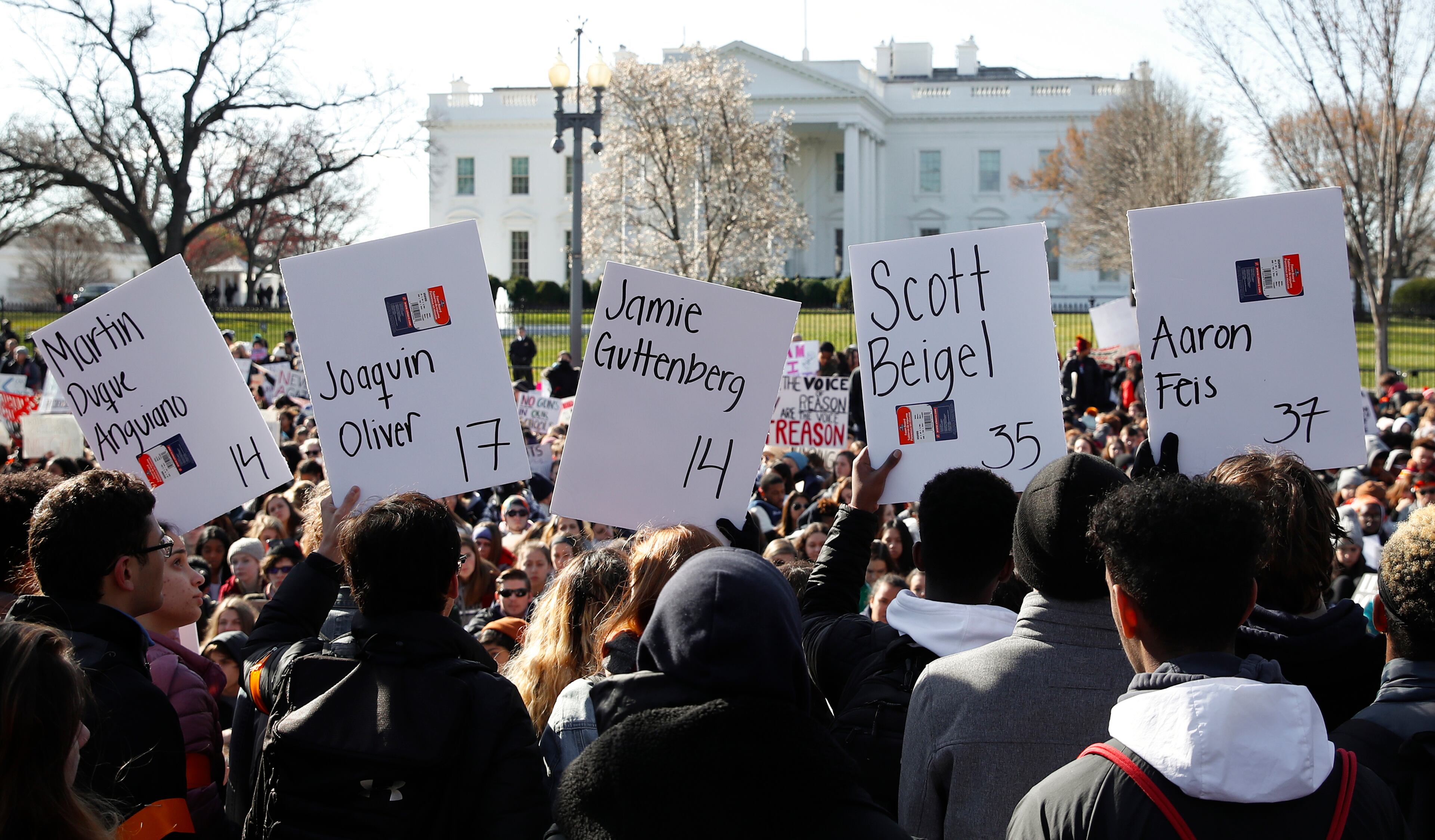 Students hold up signs with names of victims of the massacre at Florida's Marjory Stoneman Douglas High School during a rally in front of the White House in Washington, Wednesday, March 14, 2018. Student walked out of school to protest gun violence in the biggest demonstration yet of the student activism that has emerged in response to last month's massacre of 17 people at Florida's Marjory Stoneman Douglas High School. (AP Photo/Carolyn Kaster)