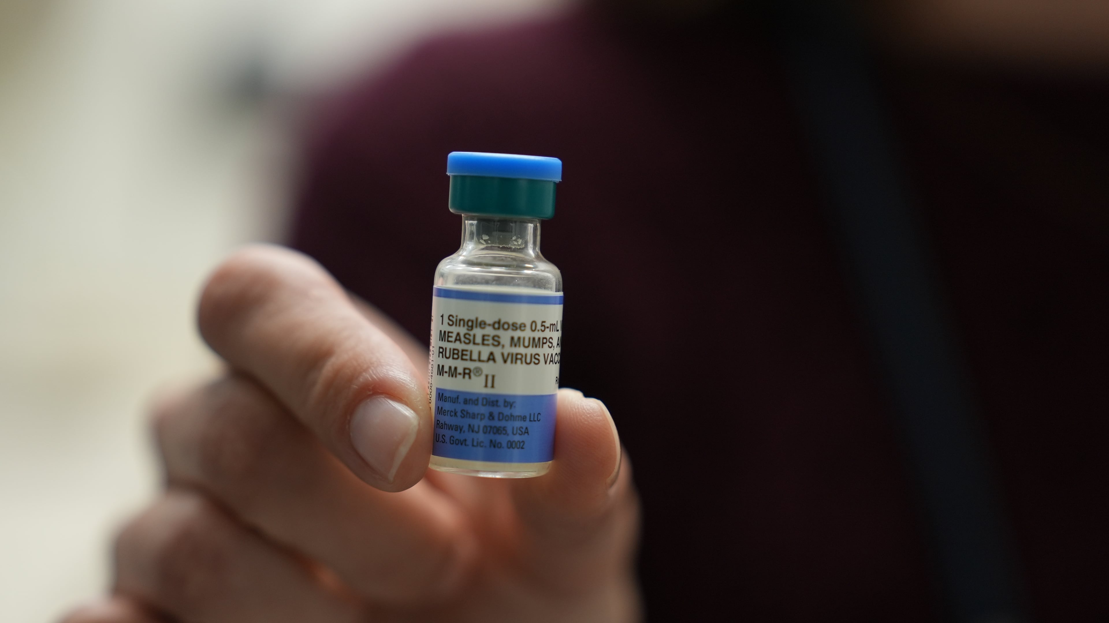 Dr. Jessica Early holds a vial of the combination measles, mumps and rubella vaccine at Prisma Health Pediatrics in Greer, S.C., on March 18, 2026. (AP Photo/Mary Conlon)