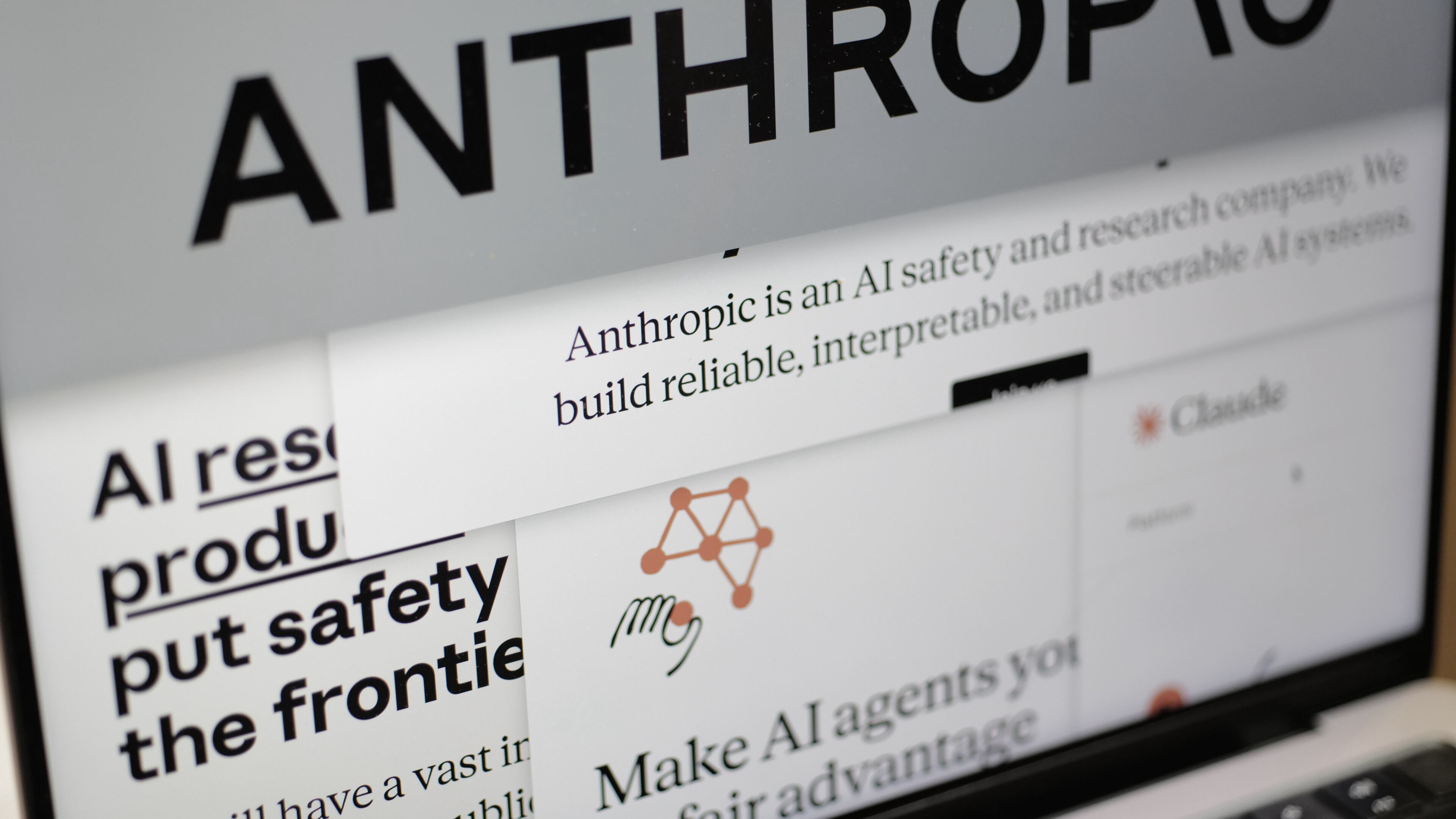 FILE - Pages from the Anthropic website and the company's logo are displayed on a computer screen in New York, Feb. 26, 2026. (AP Photo/Patrick Sison, File)