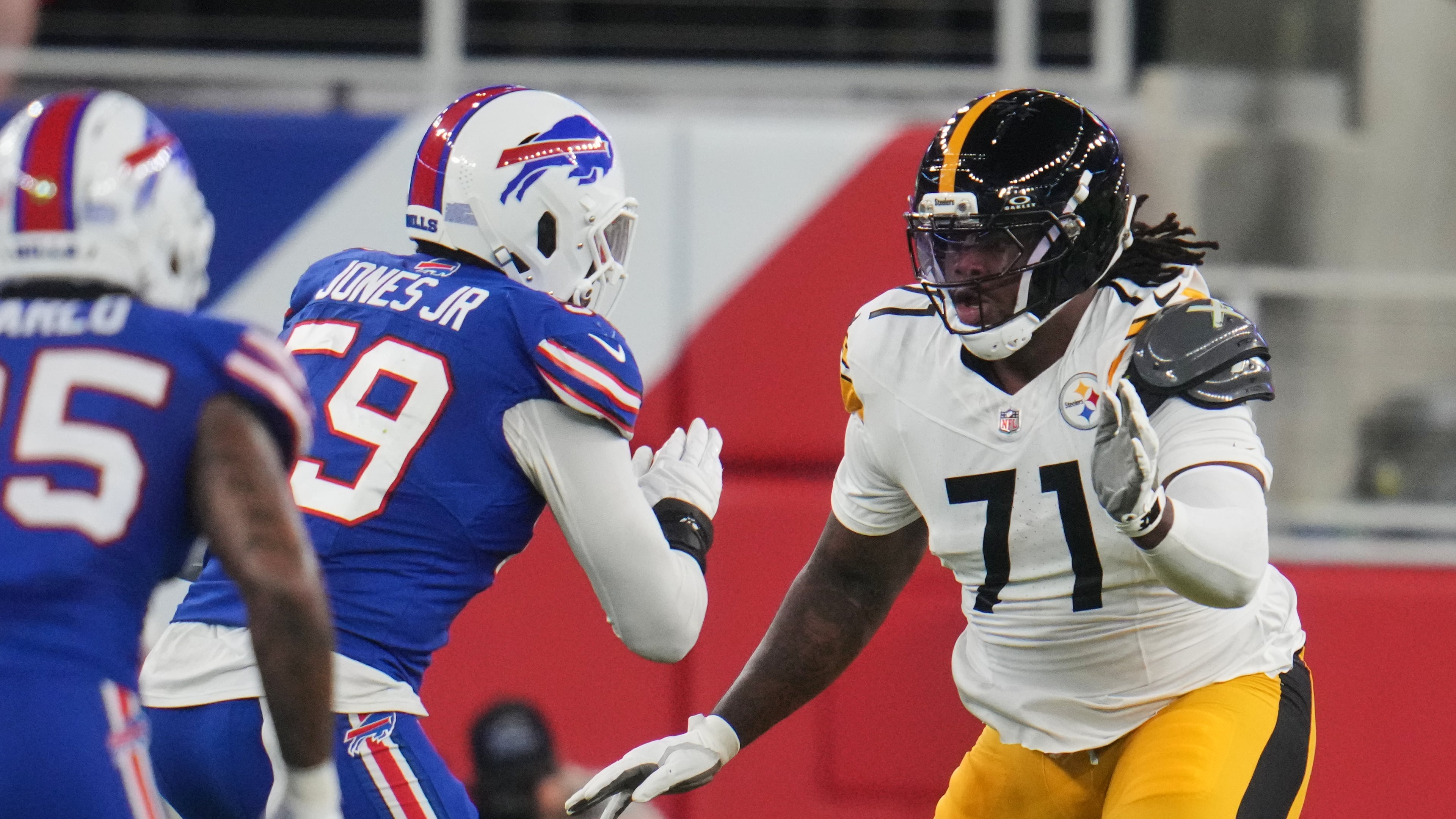 Pittsburgh Steelers offensive tackle Max Iheanachor (71) defends against the rush by Buffalo Bills' Andre Jones Jr. (59) in the first half of a preseason NFL football game in Orchard Park, NY., Thursday, Aug. 27, 2026. (AP Photo/Gene J. Puskar)