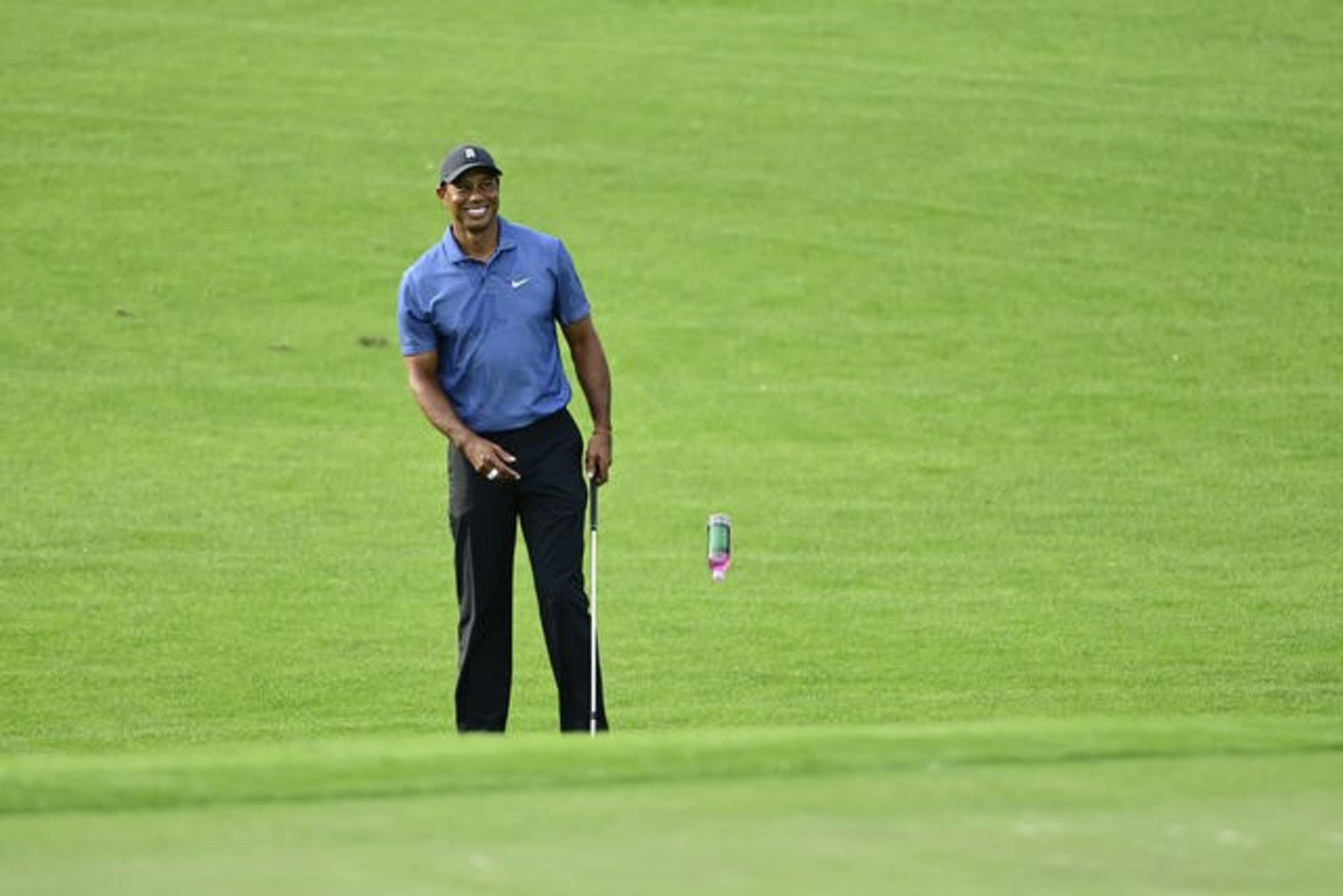 Reigning Masters champion Tiger Woods smiles on the No. 2 hole during the practice round for the Masters at Augusta National Golf Club Sunday, Nov. 8, 2020, in Augusta, Ga..