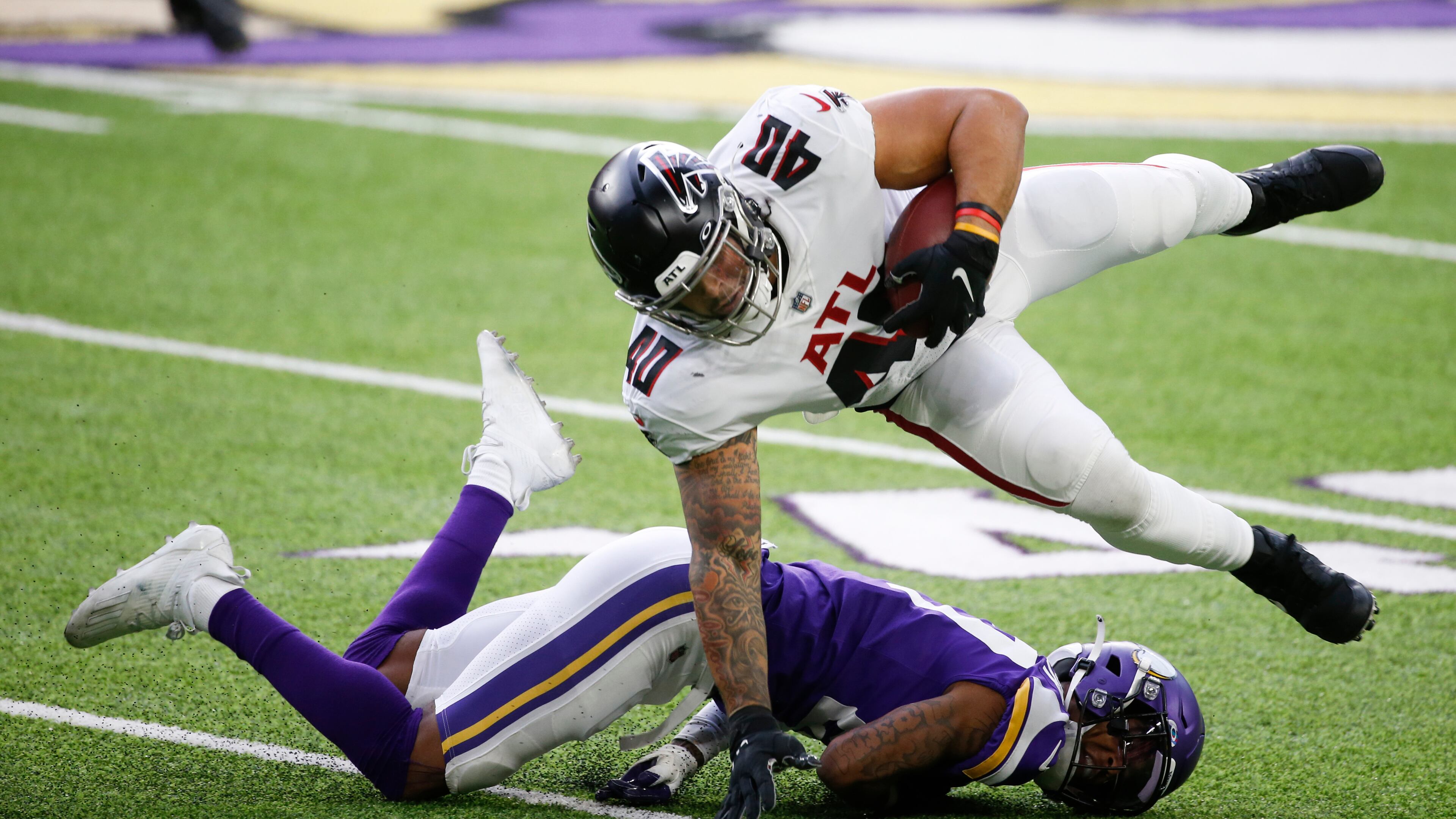Atlanta Falcons fullback Keith Smith (40) is tackled by Minnesota Vikings cornerback Cameron Dantzler during the first half Sunday, Oct. 18, 2020, in Minneapolis. (Bruce Kluckhohn/AP)