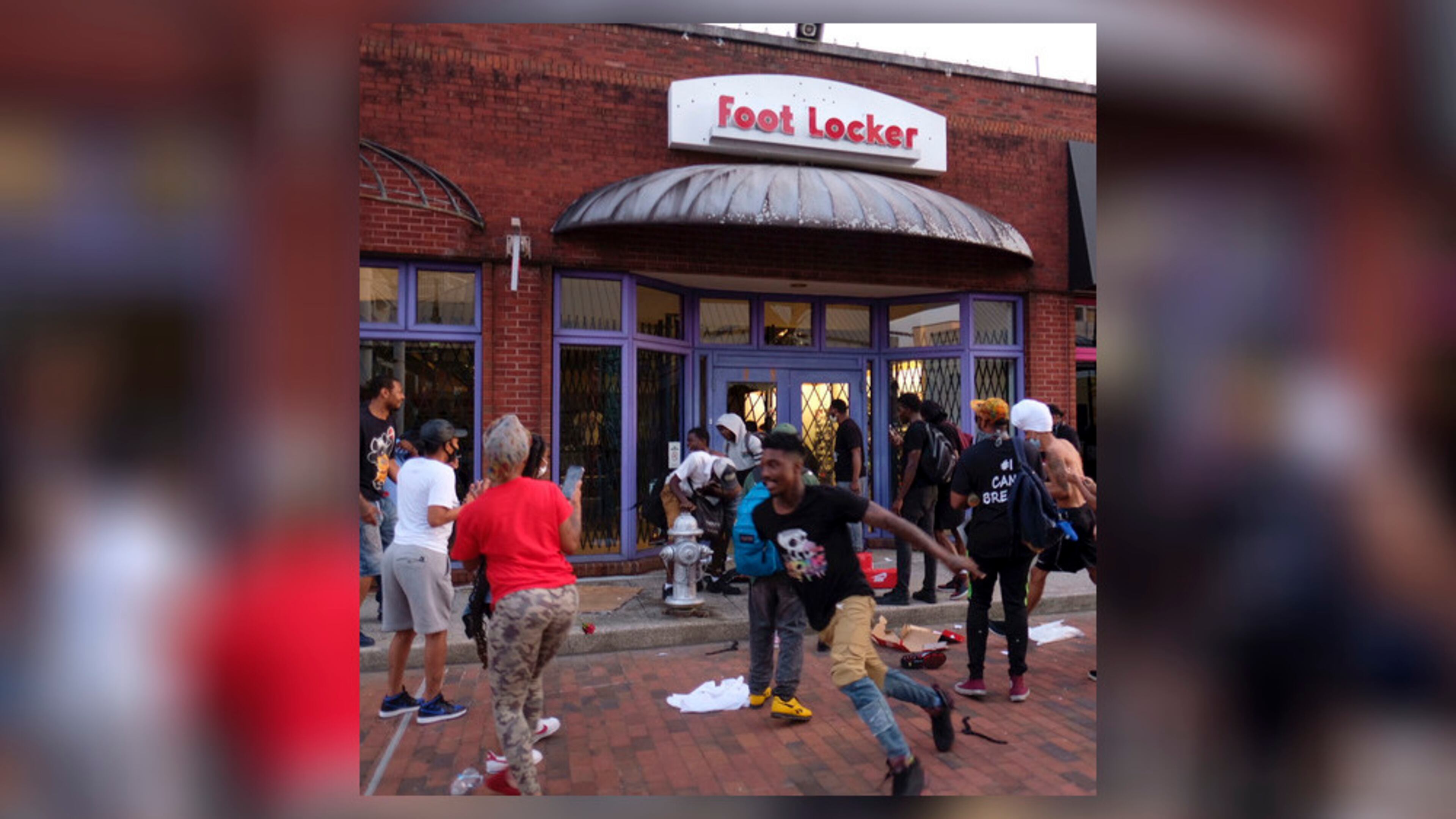 Looters steal from a Foot Locker Store in downtown Atlanta as protests continued for a fourth day. Protests over the death of George Floyd in Minneapolis police custody continued around the United States, as his case renewed anger about others involving African Americans, police and race relations.