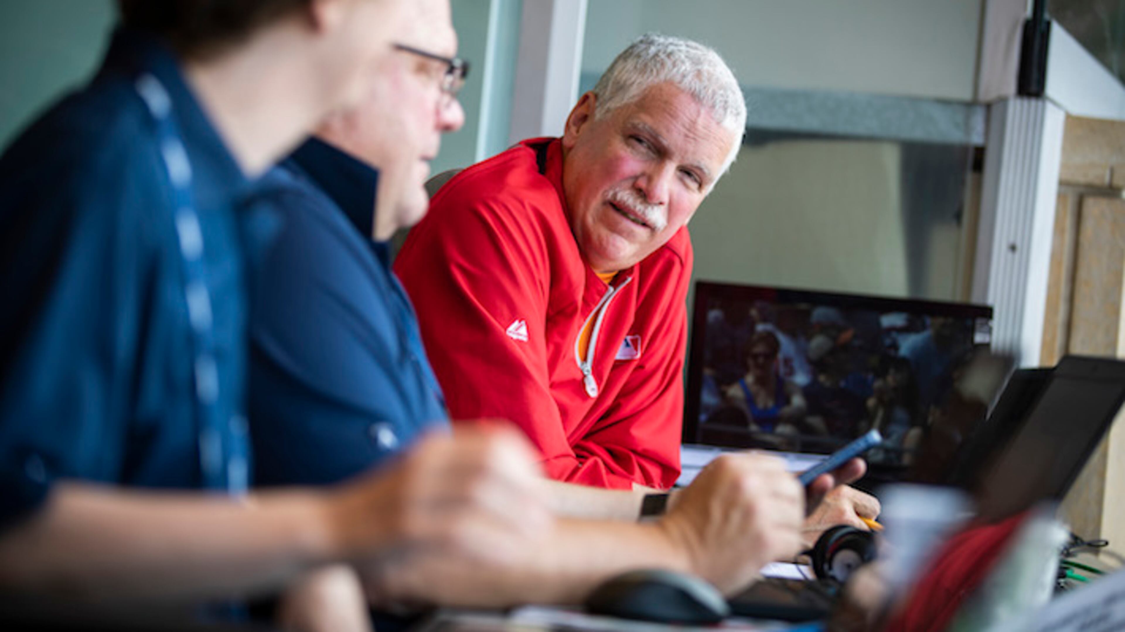 Scorekeeper Stew Thornley chats with colleagues between innings on June 5, 2018 during game one of a double header between the Minnesota Twins and Chicago White Sox at Target Field in Minneapolis, Minn. (Leila Navidi/Minneapolis Star Tribune/TNS)