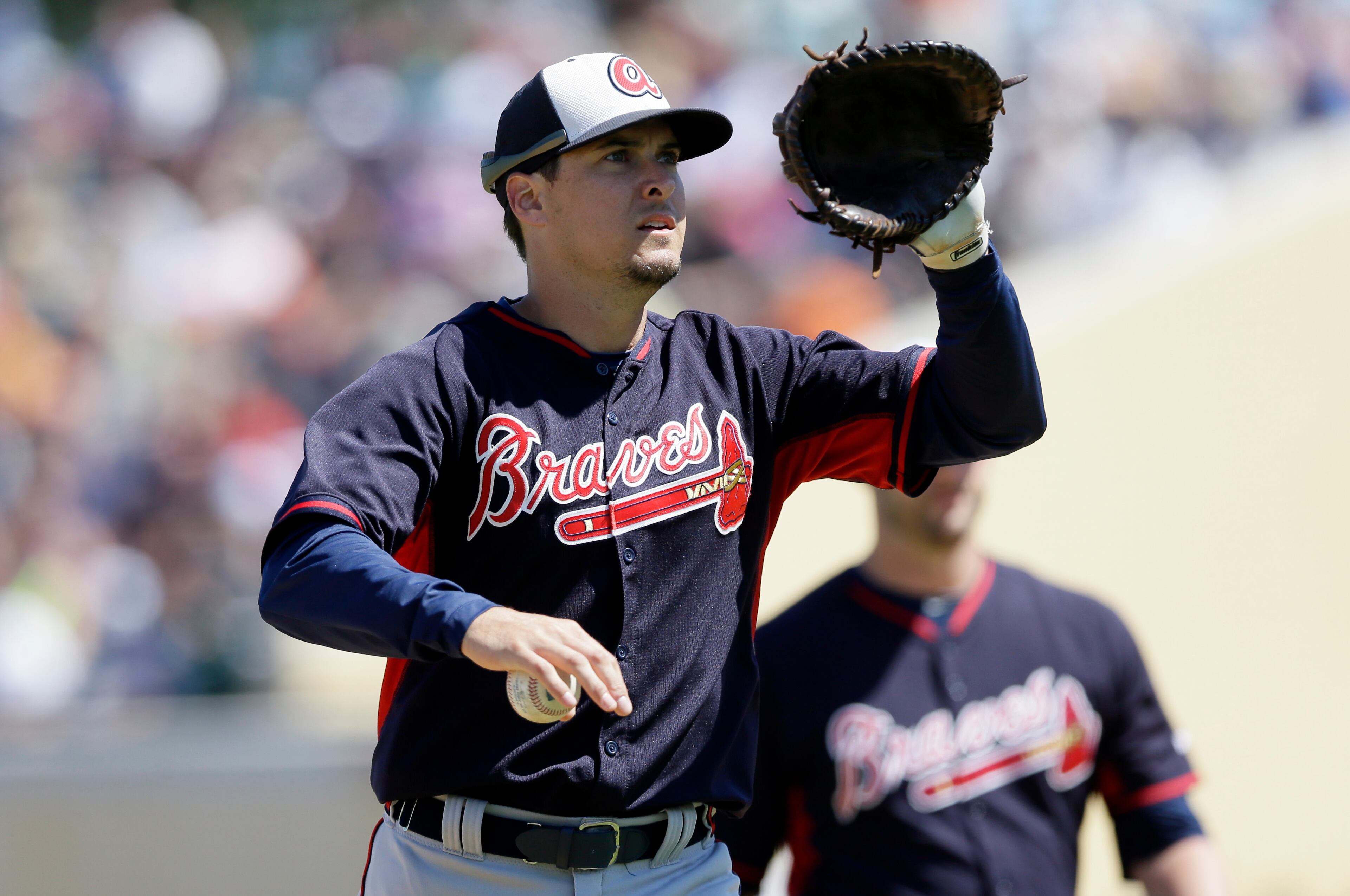 Atlanta Braves first baseman Kelly Johnson runs to the dugout during the sixth inning of a spring training exhibition baseball game against the Detroit Tigers in Lakeland, Fla., Monday, March 30, 2015. (AP Photo/Carlos Osorio)