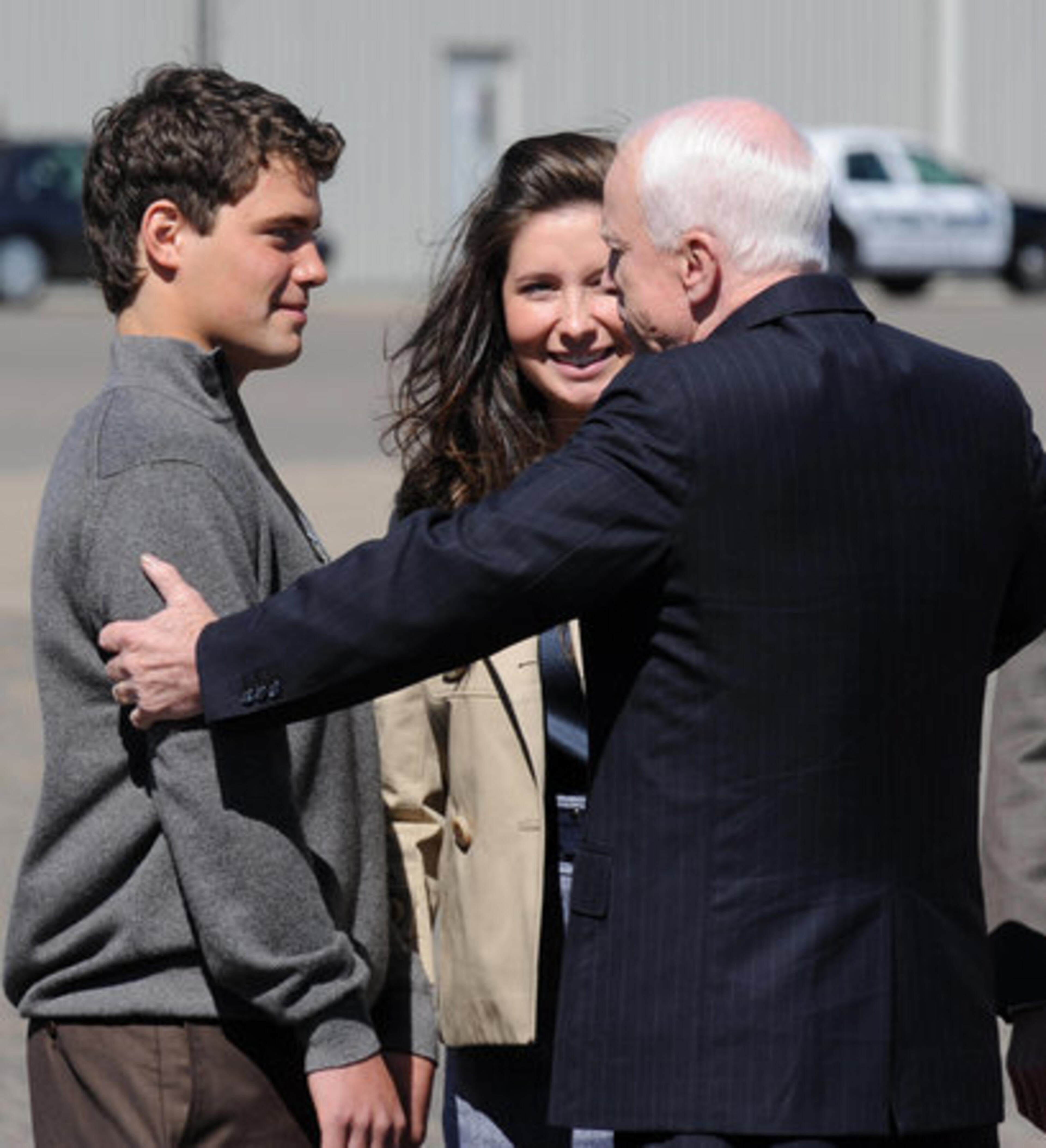 Republican presidential candidate John McCain greets his running mate Alaska Governor Sarah Palin's daughter Bristol and her boyfriend Levi Johnston (left) as he arrives at the airport in Minneapolis, Minn., on Wednesday.