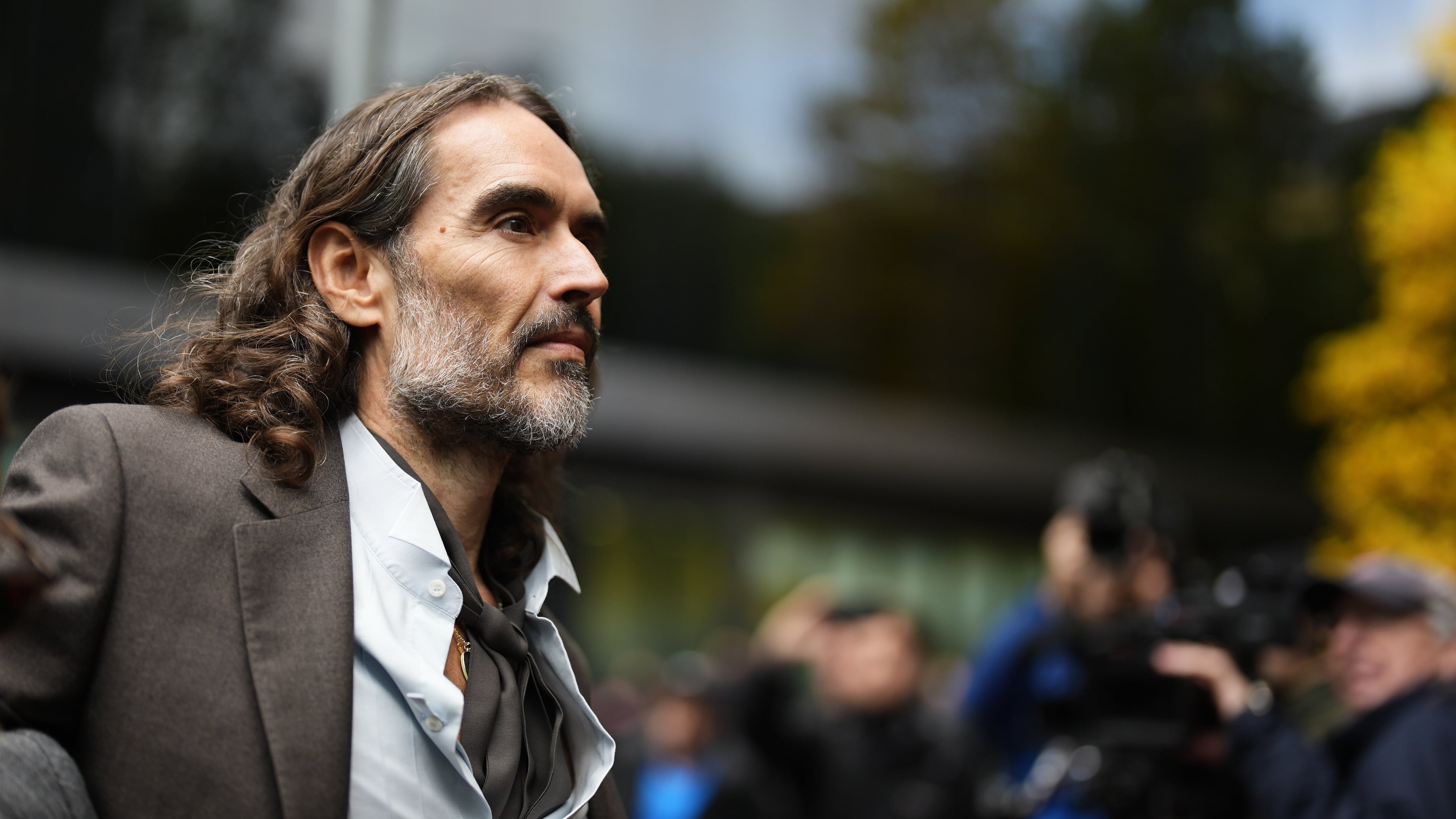 Russell Brand arrives at Southwark Crown Court, London, Tuesday, Oct. 27, 2026, where he faces three charges of rape, indecent assault, and three counts of sexual assault, relating to six women. (Jordan Pettitt/PA via AP)