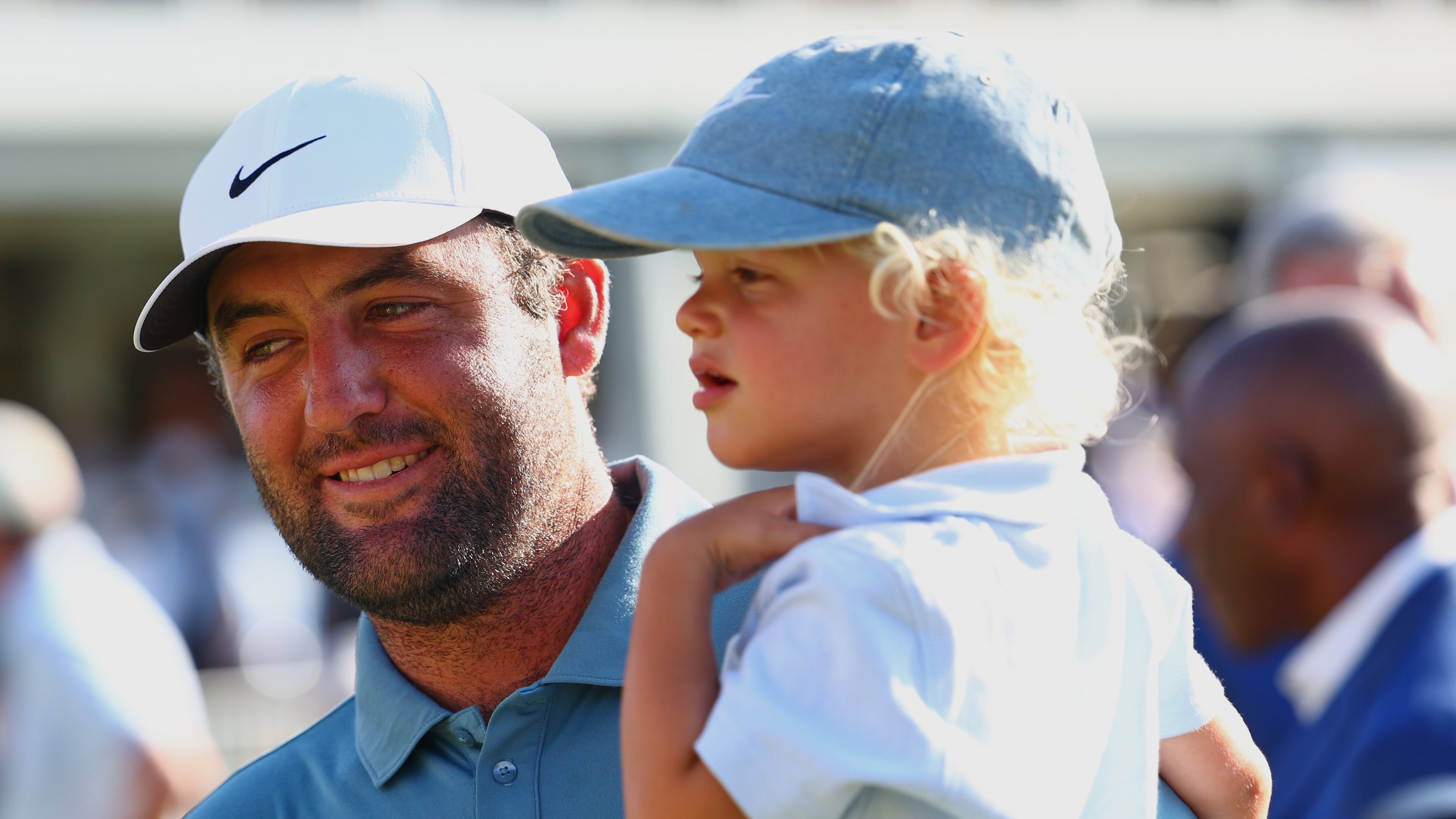 Scottie Scheffler holds his child Bennett after winning the PGA Tour Championship golf tournament Sunday, Aug. 30, 2026, in Atlanta. (AP Photo/Colin Hubbard)