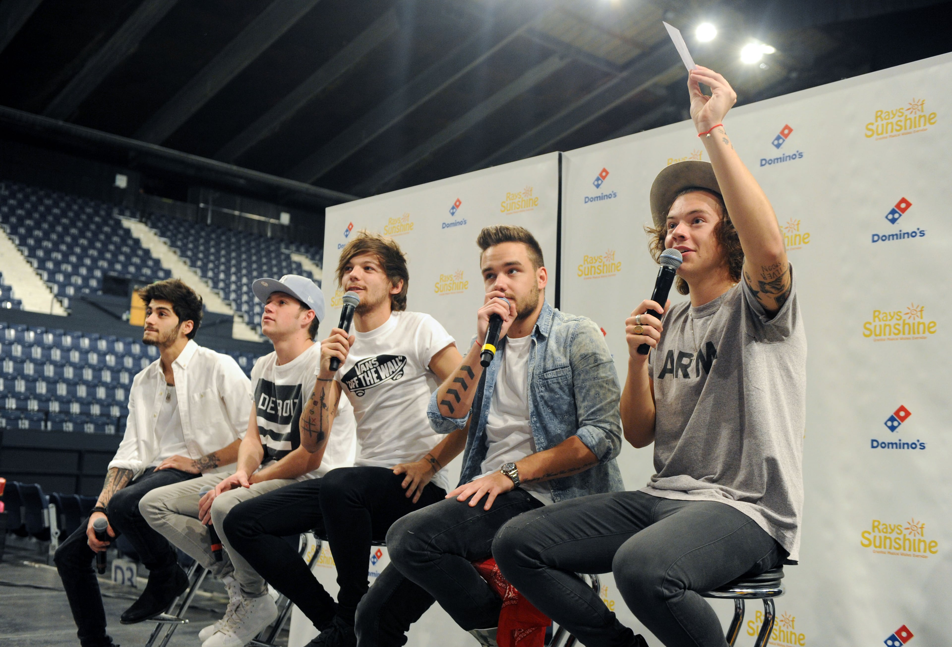 LONDON, ENGLAND - JUNE 08: Zayn Malik, Niall Horan, Louis Tomlinson, Liam Payne and Harry Styles of One Direction speak to children at Wembley Arena as they made the wishes of 60 seriously ill children come true and met the children prior to performing at Wembley Stadium on June 8, 2014 in London, United Kingdom. The band are ambassadors for Rays of Sunshine, a children's charity which grants wishes for seriously ill children in the UK. www.raysofsunshine.org.uk (Photo by Stuart C. Wilson/Getty Images for Rays of Sunshine)