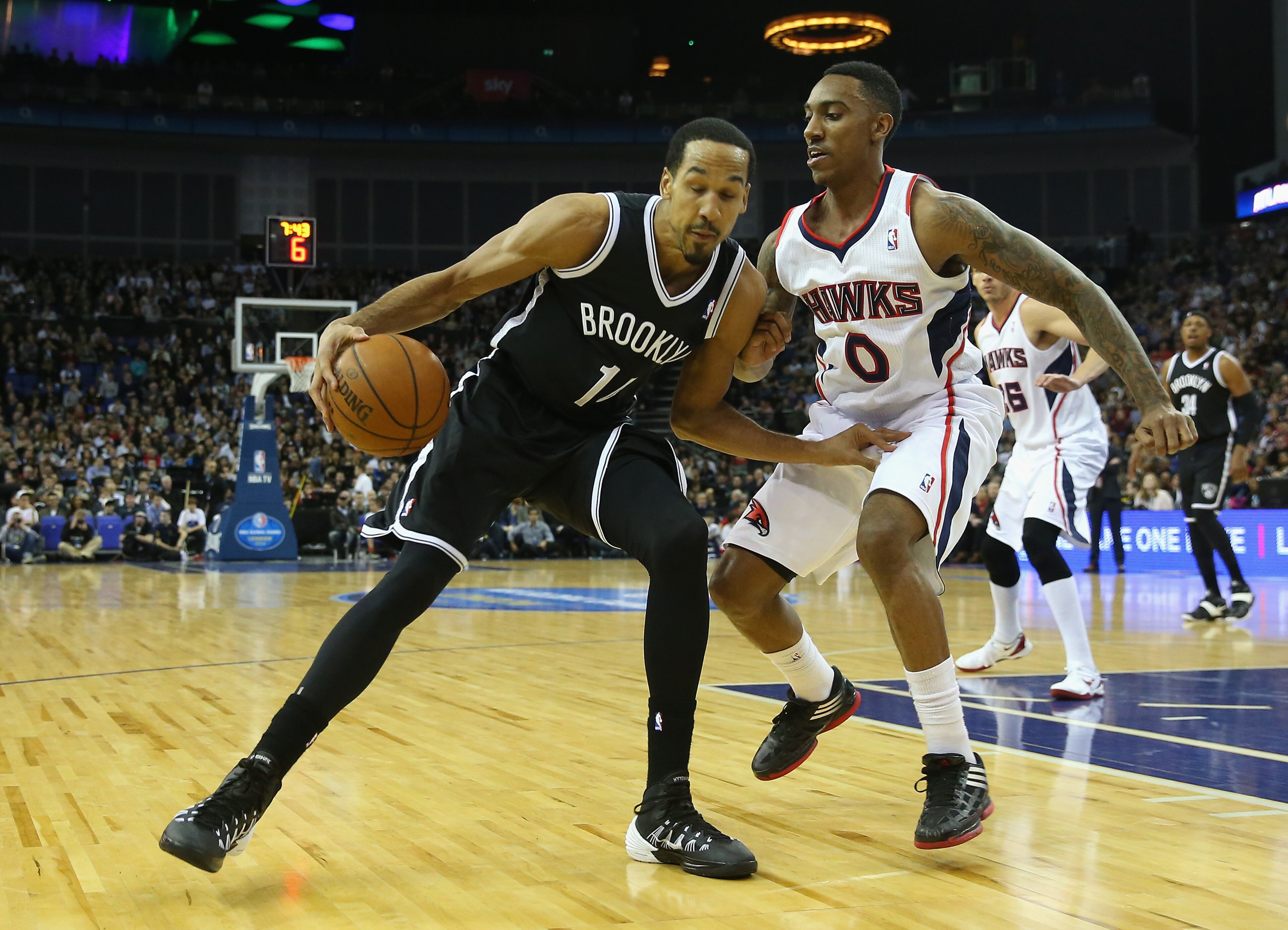 Shaun Livingston of Brooklyn Nets in action with Jeff Teague of Atlanta Hawks during the Eastern Conference NBA match between Brooklyn Nets and Atlanta Hawks at O2 Arena on January 16, 2014 in London, England.