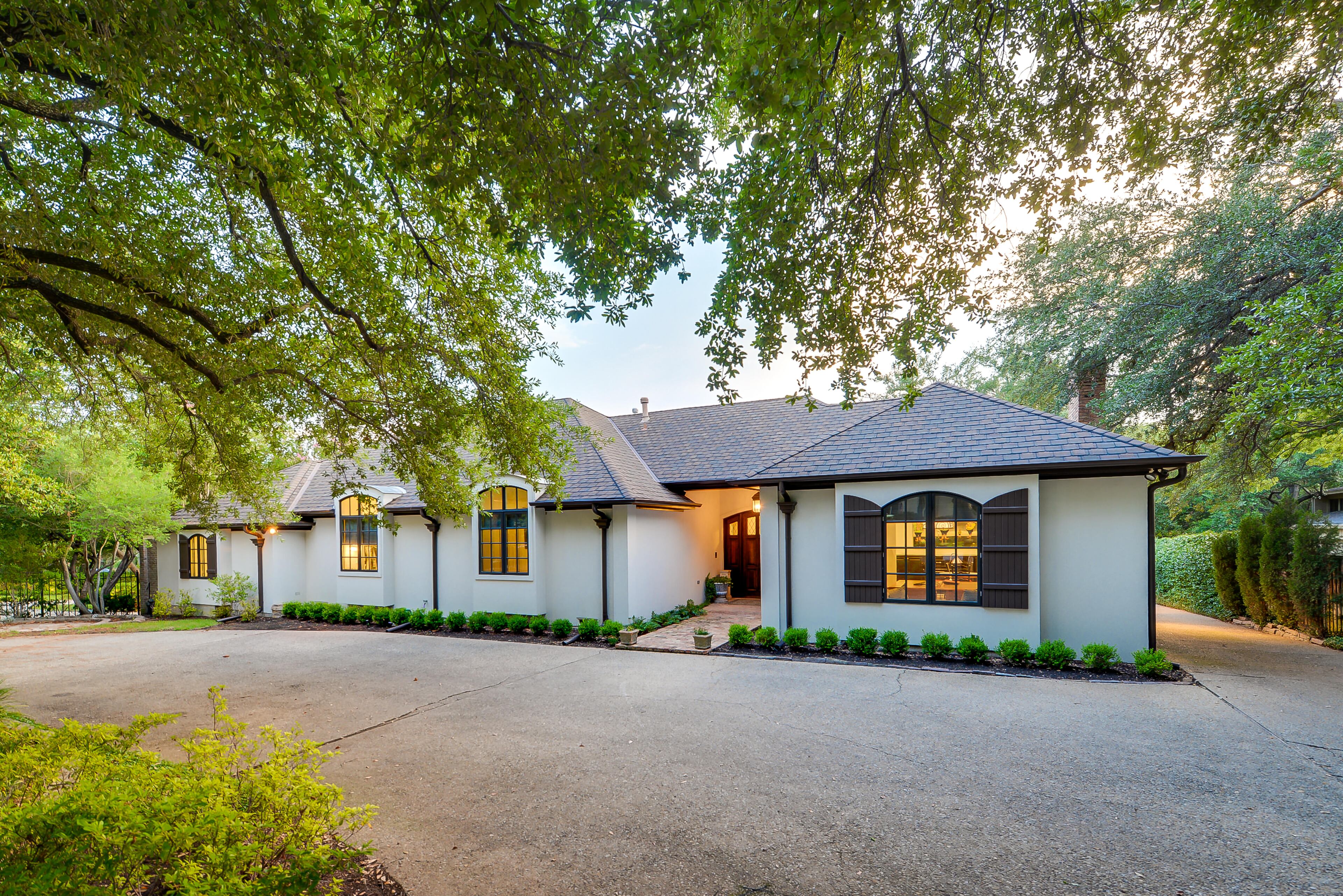 This July 15, 2013, photo courtesy of Rogers Healy and Associates Real Estate shows Chuck Norris' Dallas home, which was also featured as Texas Ranger Cordell Walker's house in the former television series "Walker, Texas Ranger." Rogers Healy, of Rogers Healy and Associates Real Estate has listed the 7,362-square-foot home for $1.2 million. The seven-bathroom and four-bedroom has been extensively renovated since the show ended in 2001. (AP Photo/Rogers Healy and Associates Real Estate)