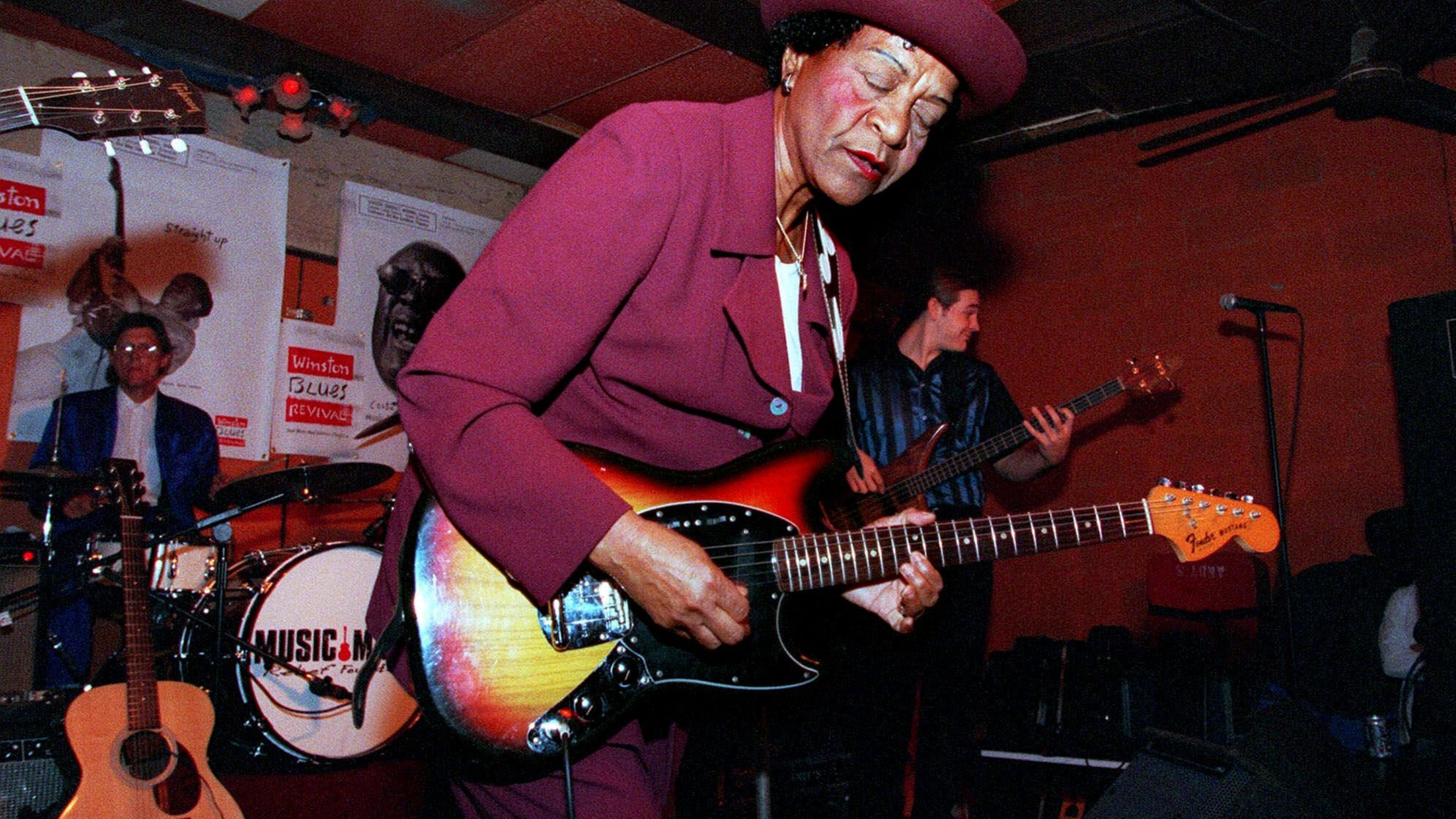 Beverly ‘Guitar’ Watkins performed in Chicago in 1998, in Chicago. Backing her up is drummer Artie Dean, left, and bass guitarist, right, is Jon Schwenke. (AP Photo/Stephen J. Carrera)