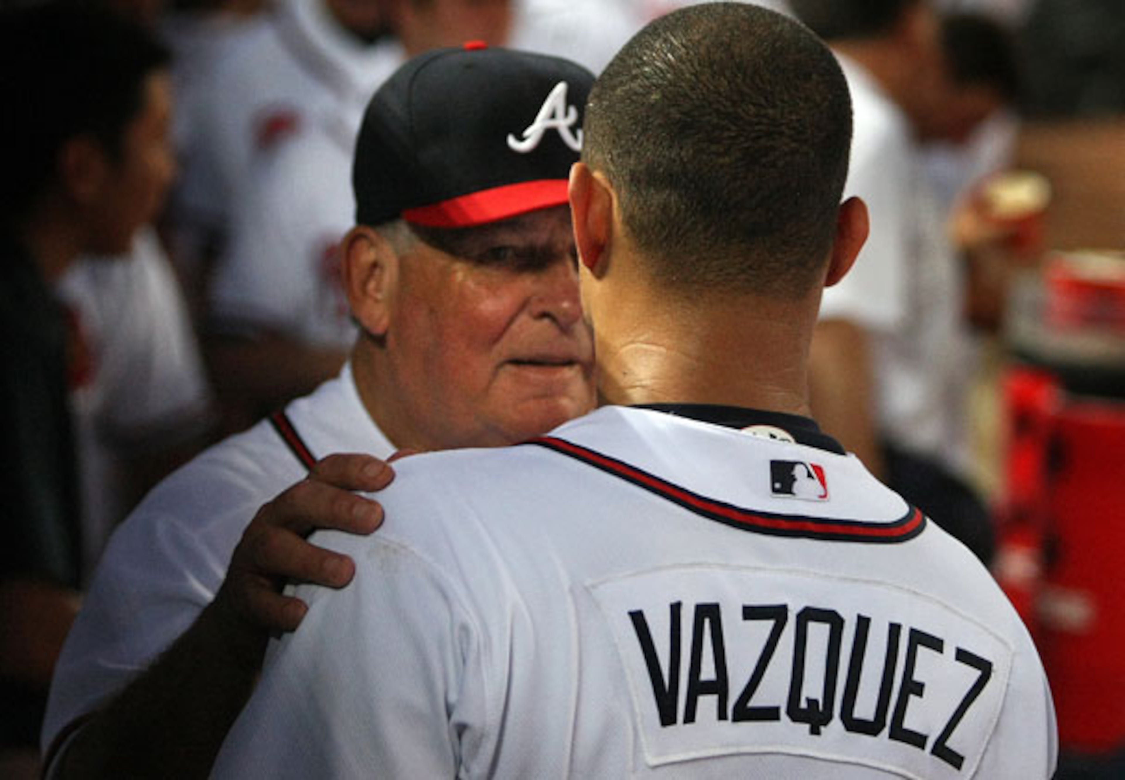 Bobby Cox was known for always supporting and encouraging his players, like starting pitcher Javier Vazquez in this photo. (Curtis Compton/AJC file)