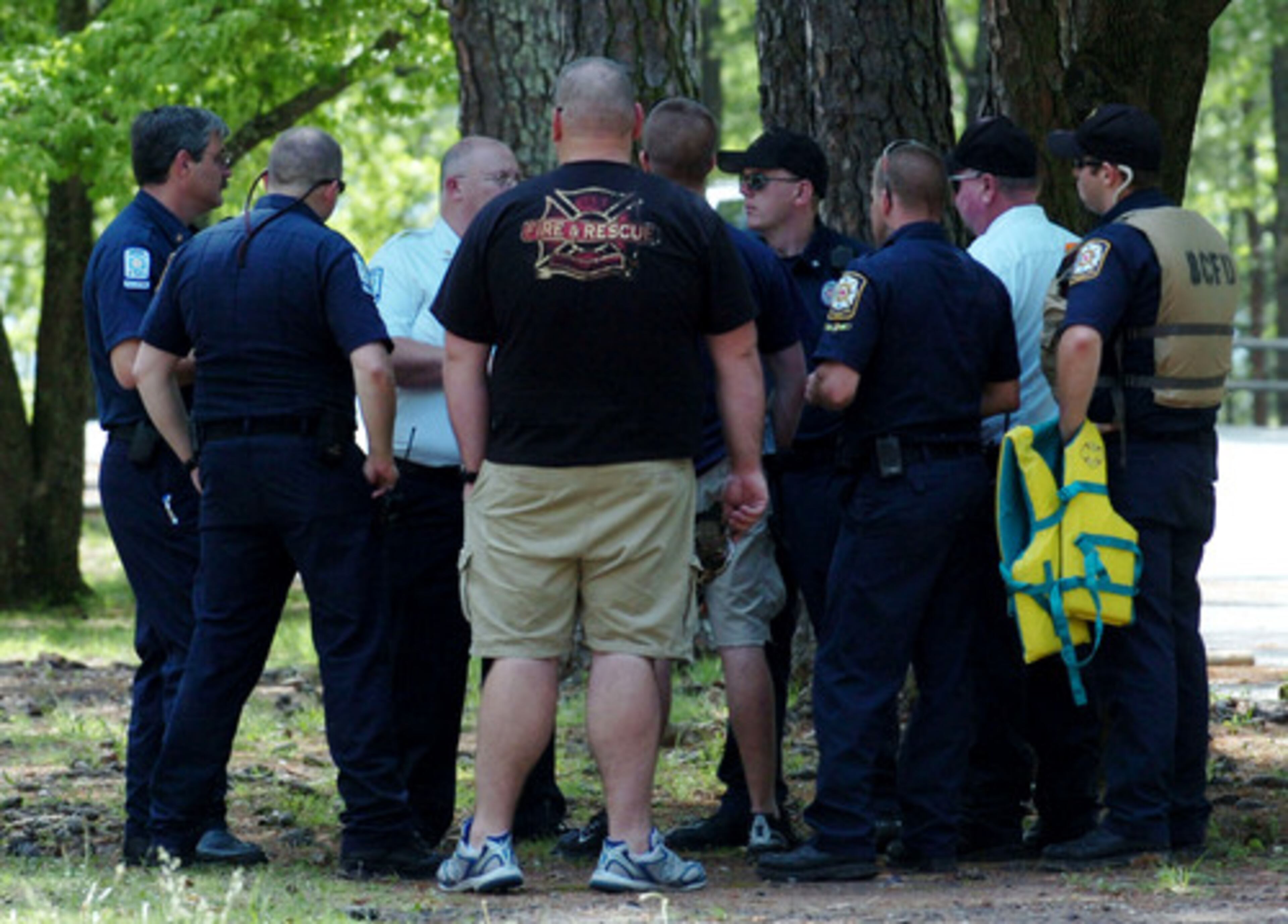 Fire and rescue personnel gathered near the site of the drowning. Divers recovered the bodies of the the teens, ages 15 and 18, from the Bartow County lake about 2:15 p.m. They had drowned while trying to swim across a 100-yard channel, about 25 yards from a rocky shoreline, said Bartow County Sheriff's Maj. Bryan Keeling.