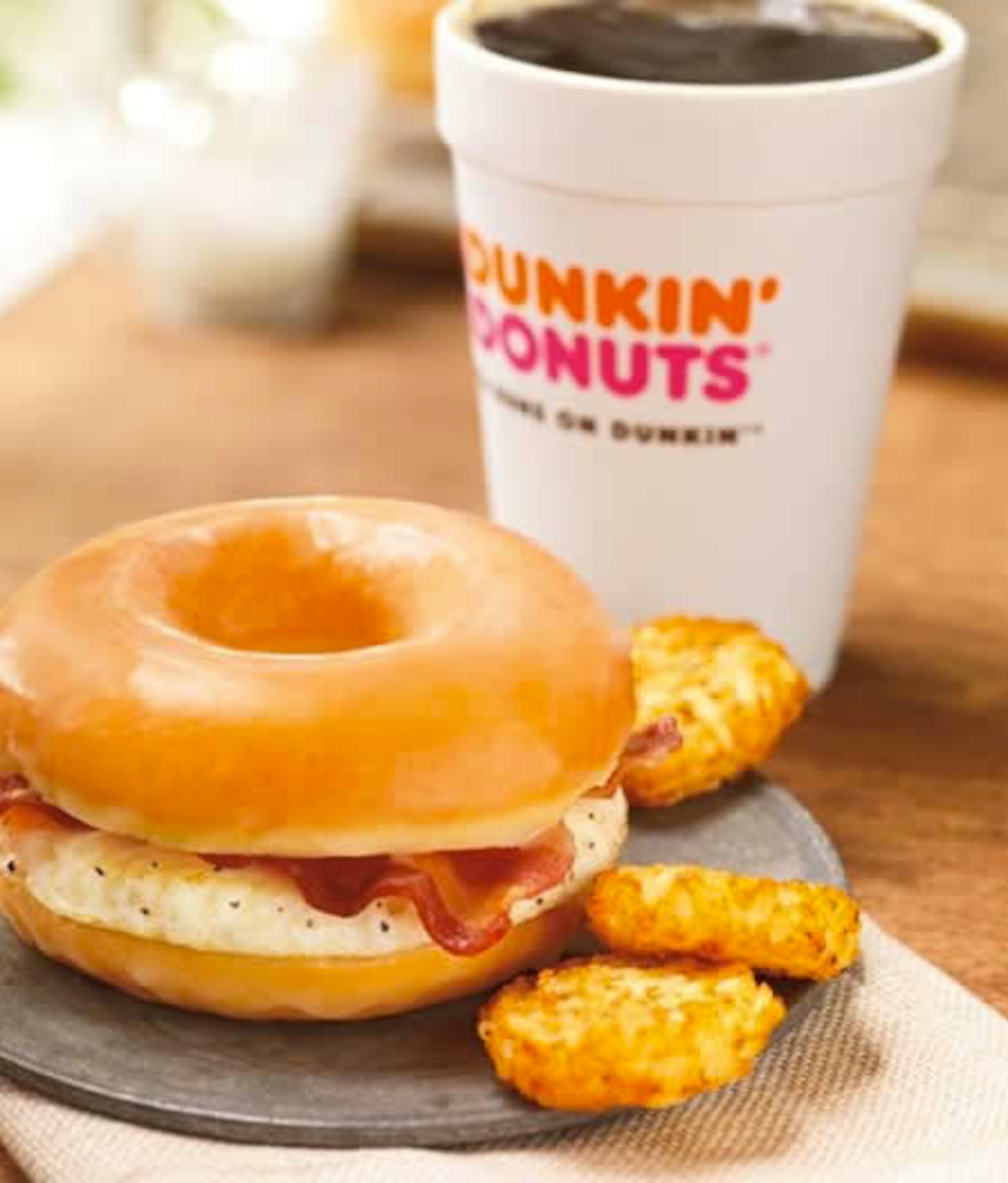 A sandwich from Dunkin' Donuts, which comes with fried eggs and bacon between a split glazed doughnut, became a part of the permanent menu June 7th, 2013, which the chain claims is "National Donut Day." Dunkin' Donuts had tested the sandwich in select stores in eastern Massachusetts in April, creating considerable buzz online. Notably, Dunkin' Donuts says the "Glazed Donut Breakfast Sandwich" clocks in at 360 calories, which is less than the 390 calories for the turkey sausage sandwich it recently introduced for people looking to eat better.