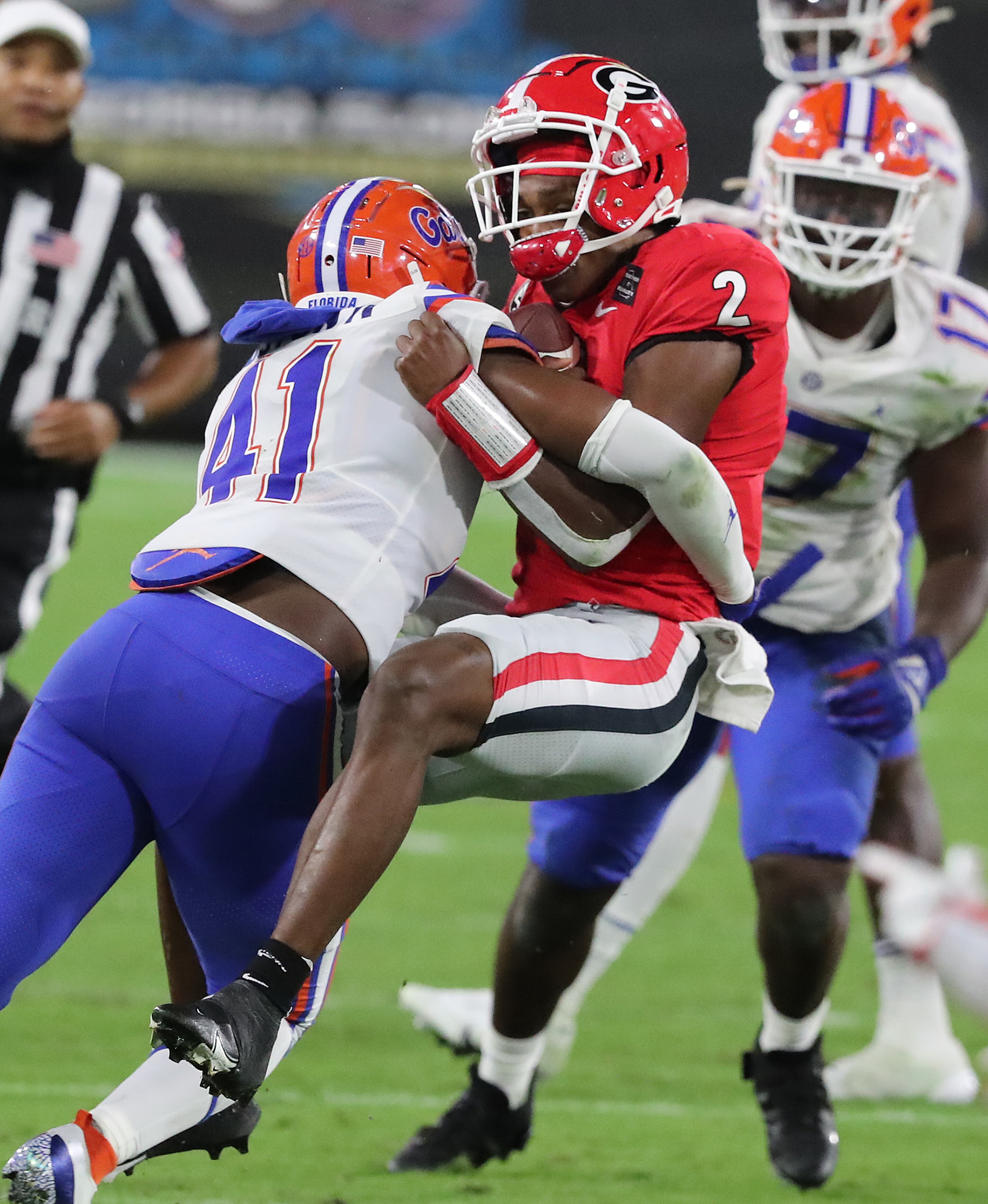 Florida linebacker James Houston IV levels Georgia quarterback D’Wan Mathis on a quarterback keeper during the third quarter in a NCAA college football game on Saturday, Nov 7, 2020, in Jacksonville. “Curtis Compton / Curtis.Compton@ajc.com”