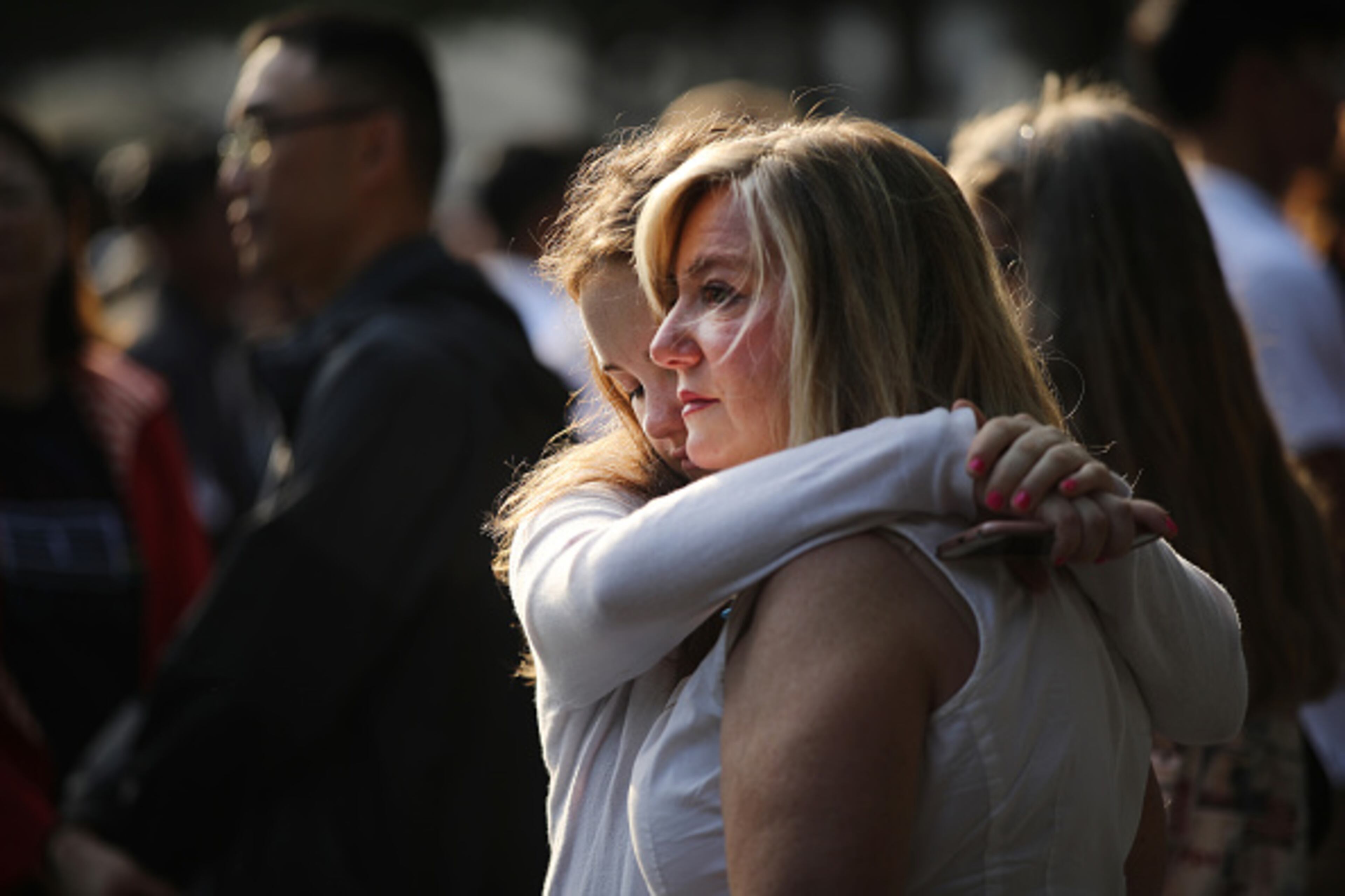 NEW YORK, NEW YORK - SEPTEMBER 11: Friends and family of victims of the September 11 terrorist attacks, pause at the National September 11 Memorial during a morning commemoration ceremony for the victims of the terrorist attacks Eighteen years after the day on September 11, 2019 in New York City. Throughout the country services are being held to remember the 2,977 people who were killed in New York, the Pentagon and in a field in rural Pennsylvania. (Photo by Spencer Platt/Getty Images)