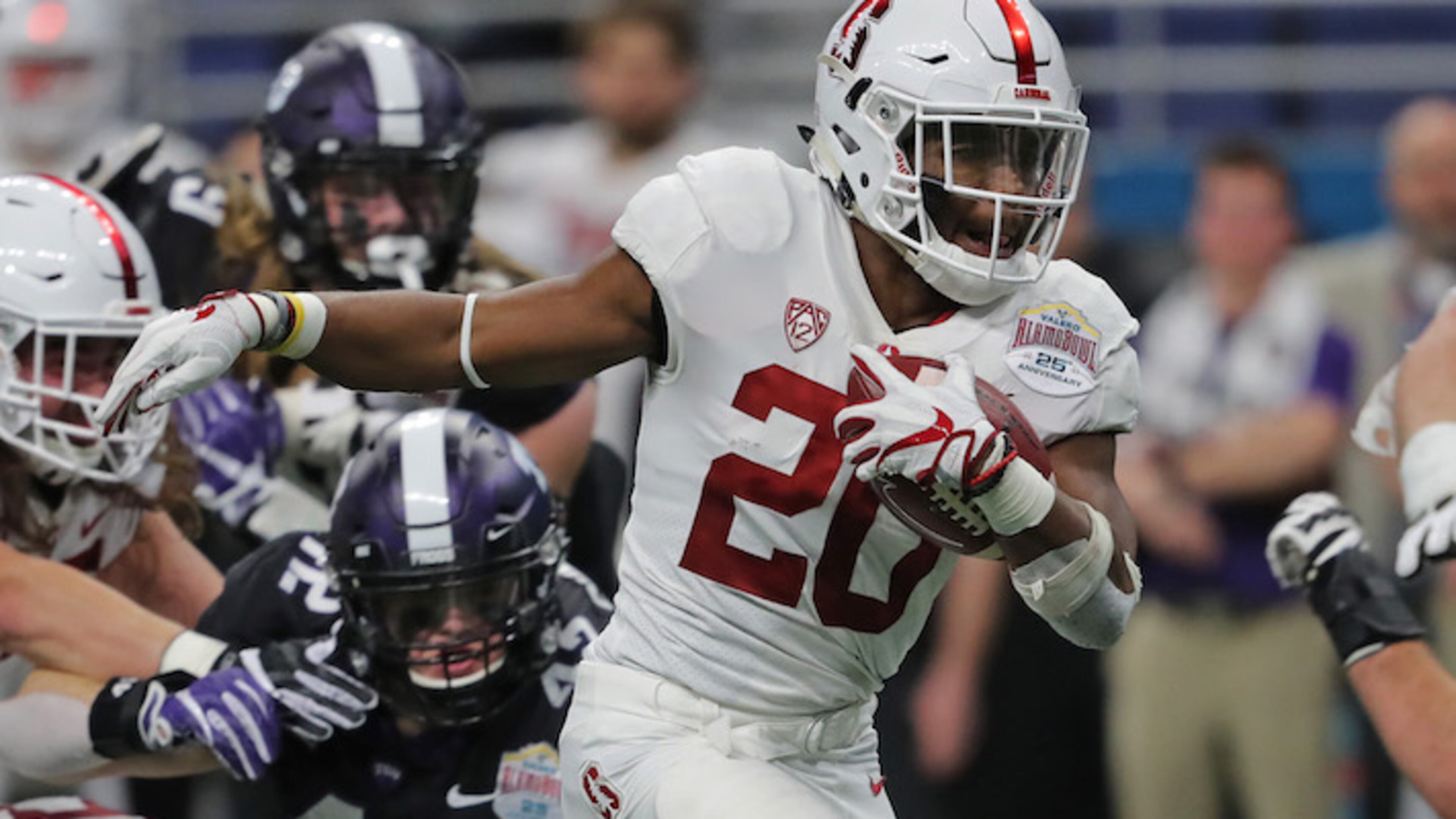 Stanford running back Bryce Love (20) carries on a 15-yard touchdown run in the first quarter against Texas Christian in the Valero Alamo Bowl at the Alamodome in San Antonio, Texas, on Thursday, Dec. 28, 2017. (Rodger Mallison/Fort Worth Star-Telegram/TNS)