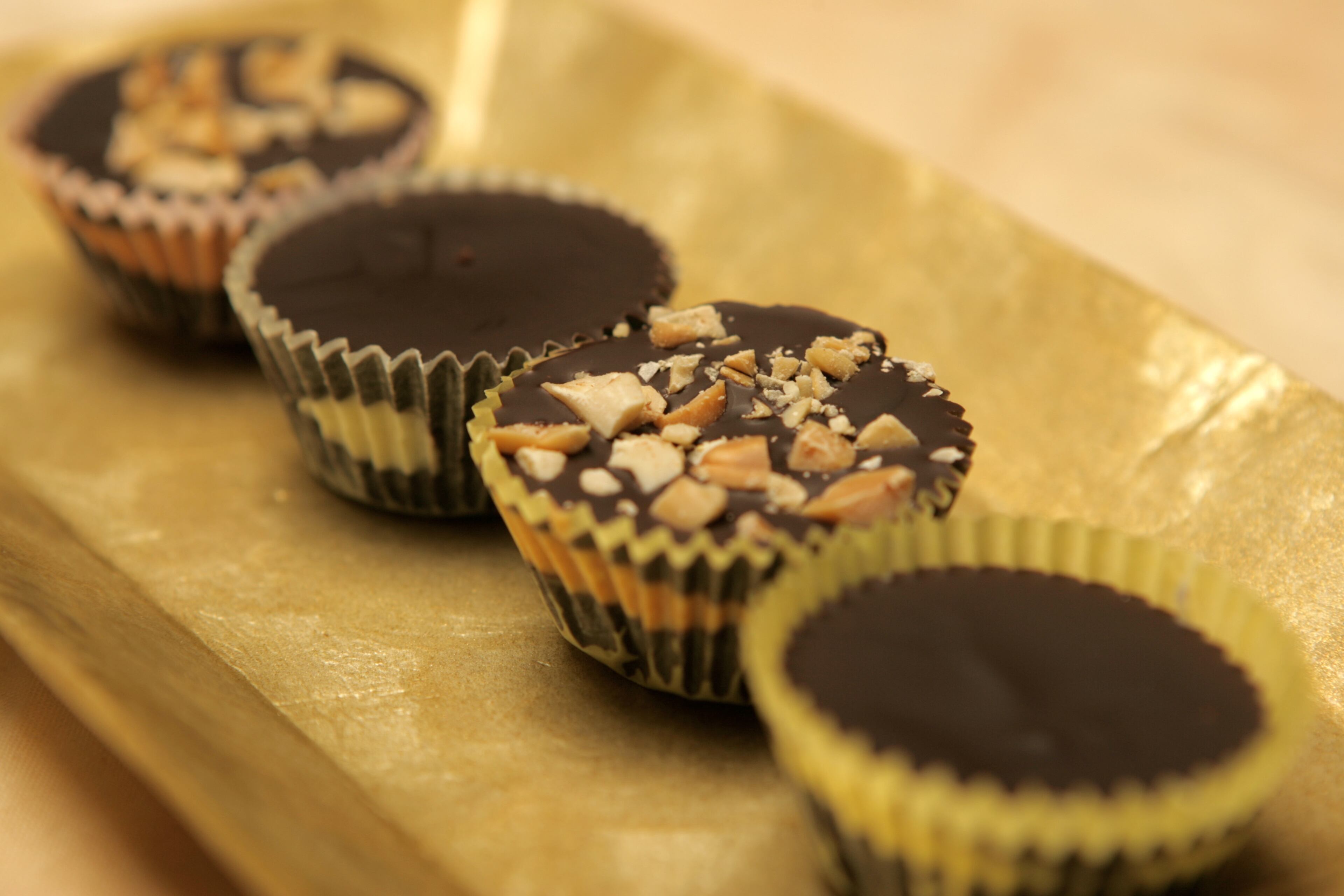 Easy Peanut Butter Cups: To make a peppermint treat, increase white chocolate to 3 ounces and add 1/2-1 teaspoon pure peppermint extract. Or for a fruity chocolate treat, mix flavored jam or jelly into the white chocolate. Hands on: 20 minutes Total time: 1 hour or more Makes: 12 servings Ingredients: 7 ounces semisweet or bittersweet chocolate, chopped 2 ounces white chocolate, chopped 1/4 cup smooth peanut butter 2 tablespoons roasted peanuts, finely chopped Instructions: Line a mini muffin pan with paper liners. In a microwave-safe bowl, microwave chocolate for 1 minute. Stop and stir. Microwave for 30 to 60 seconds more or until almost melted. Stir until completely melted. In a separate bowl, combine white chocolate and peanut butter. Microwave for 30 seconds. Stop and stir. Microwave for 30 to 60 seconds more or until almost melted. Stir until completely melted. Meanwhile, using a spoon, make a layer of semisweet chocolate (about 1/4-inch thick) in the bottom of the muffin liners. Top with a layer of peanut butter mixture and then another layer of chocolate. Sprinkle evenly with peanuts. Refrigerate until firm. Serve cold or at room temperature. Per cup: 144 calories (percent of calories from fat, 57), 3 grams protein, 15 grams carbohydrates, 1 gram fiber, 10 grams fat (5 grams saturated), no cholesterol, 40 milligrams sodium. Adapted from Martha Stewart’s Everyday Food magazine