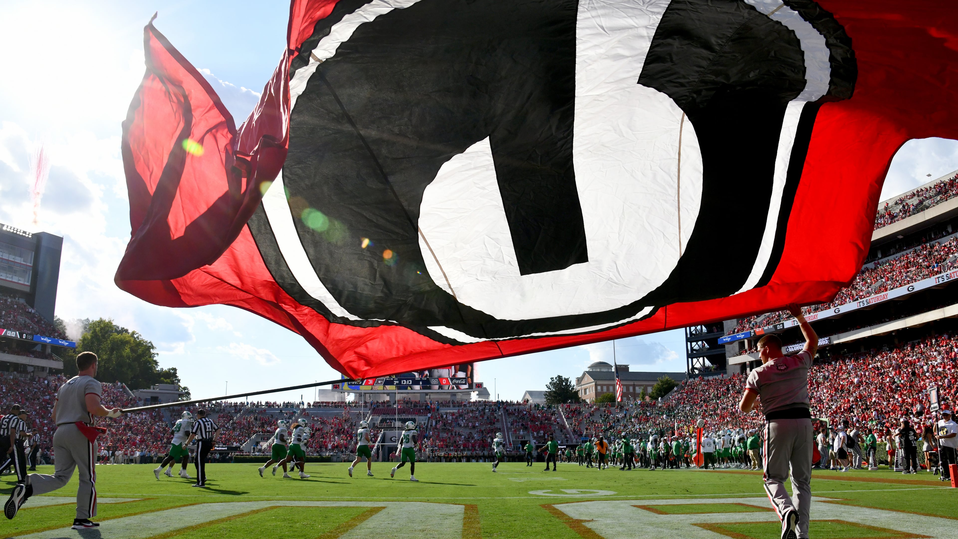 Georgia fans celebrate after wide receiver Zachariah Branch scored a touchdown during the second half in an NCAA football game at Sanford Stadium, Saturday, August 30, 2025, in Athens. Georgia won 45-7 over Marshall. (Hyosub Shin / AJC)