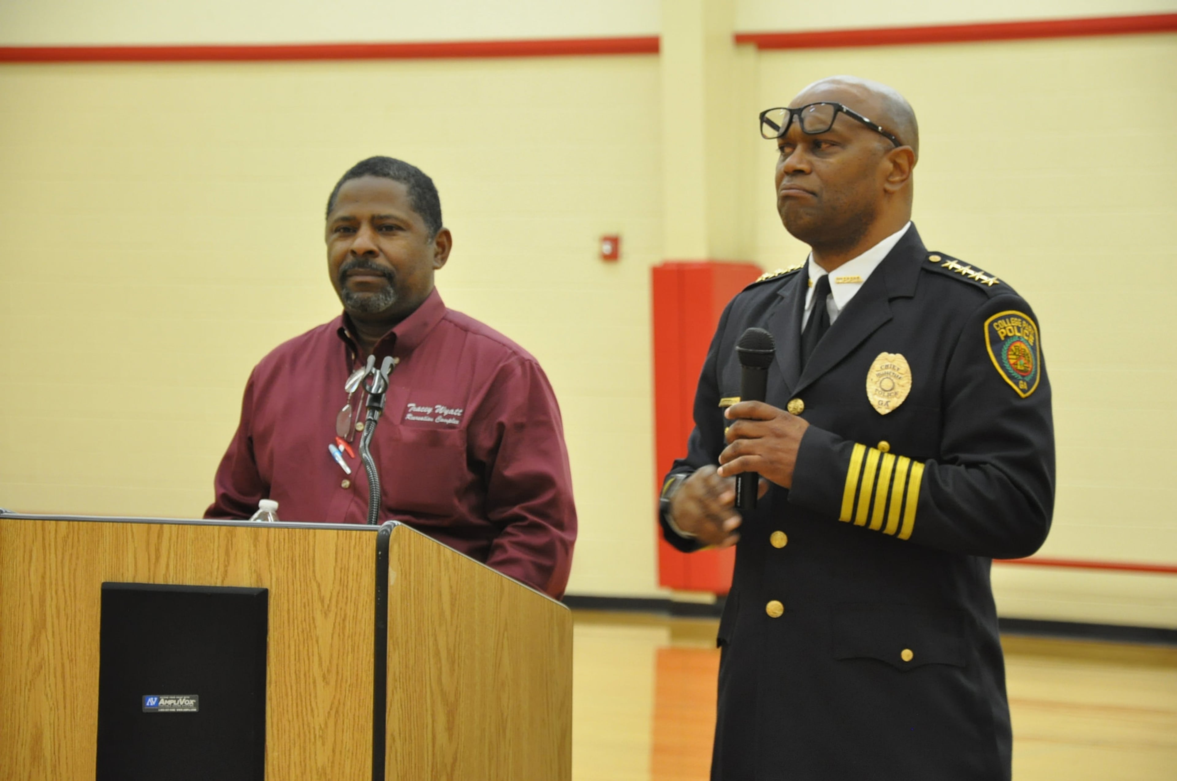 In 2017, then-College Park Ward III Councilman Tracey Wyatt and then-Fire Chief Wade Elmore address the attendees of an update on city progress. (AJC File)