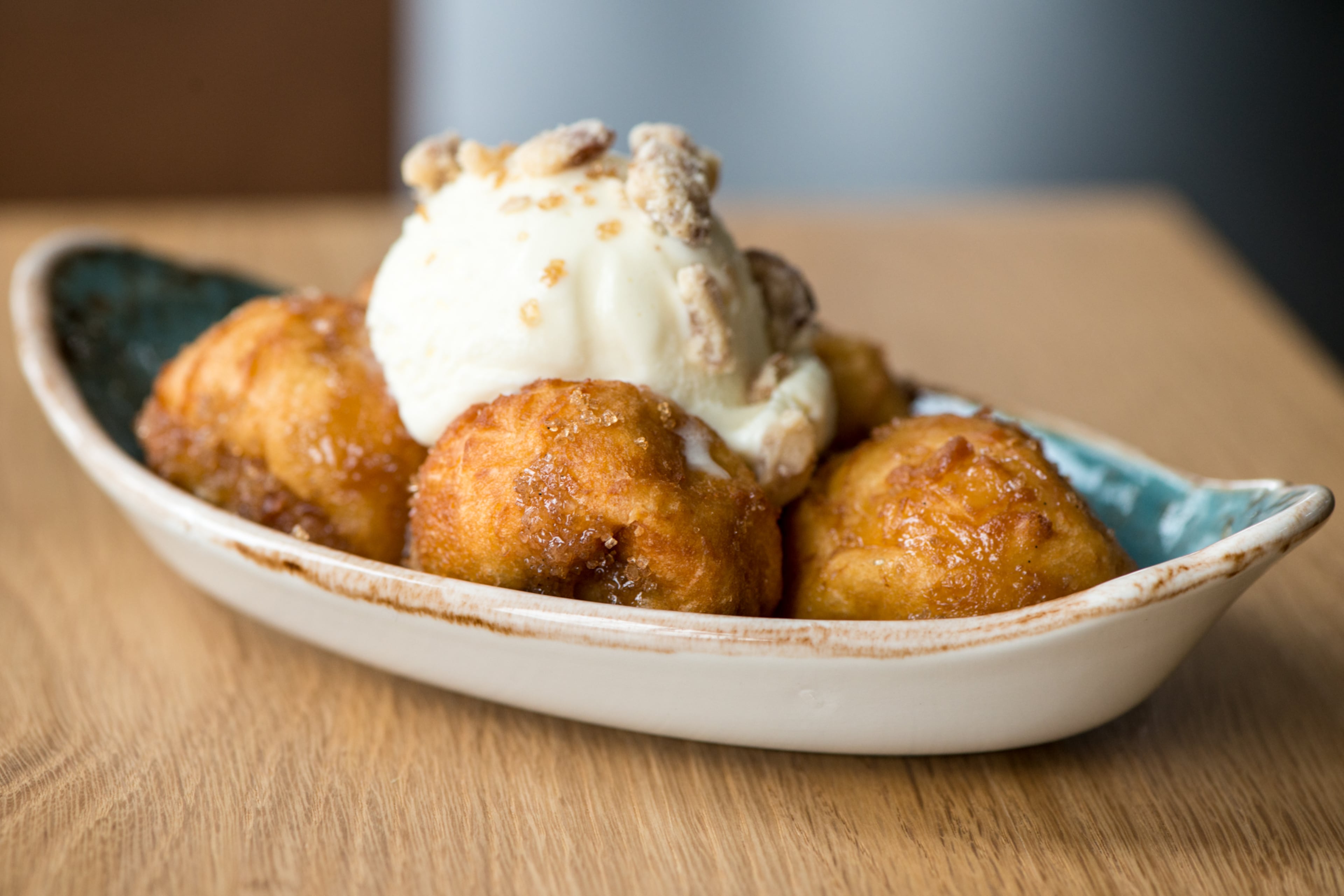 Bourbon Sugar Donut Holes with pecan praline and vanilla bean ice cream at Scout in Oakhurst. / Photo credit- Mia Yakel.