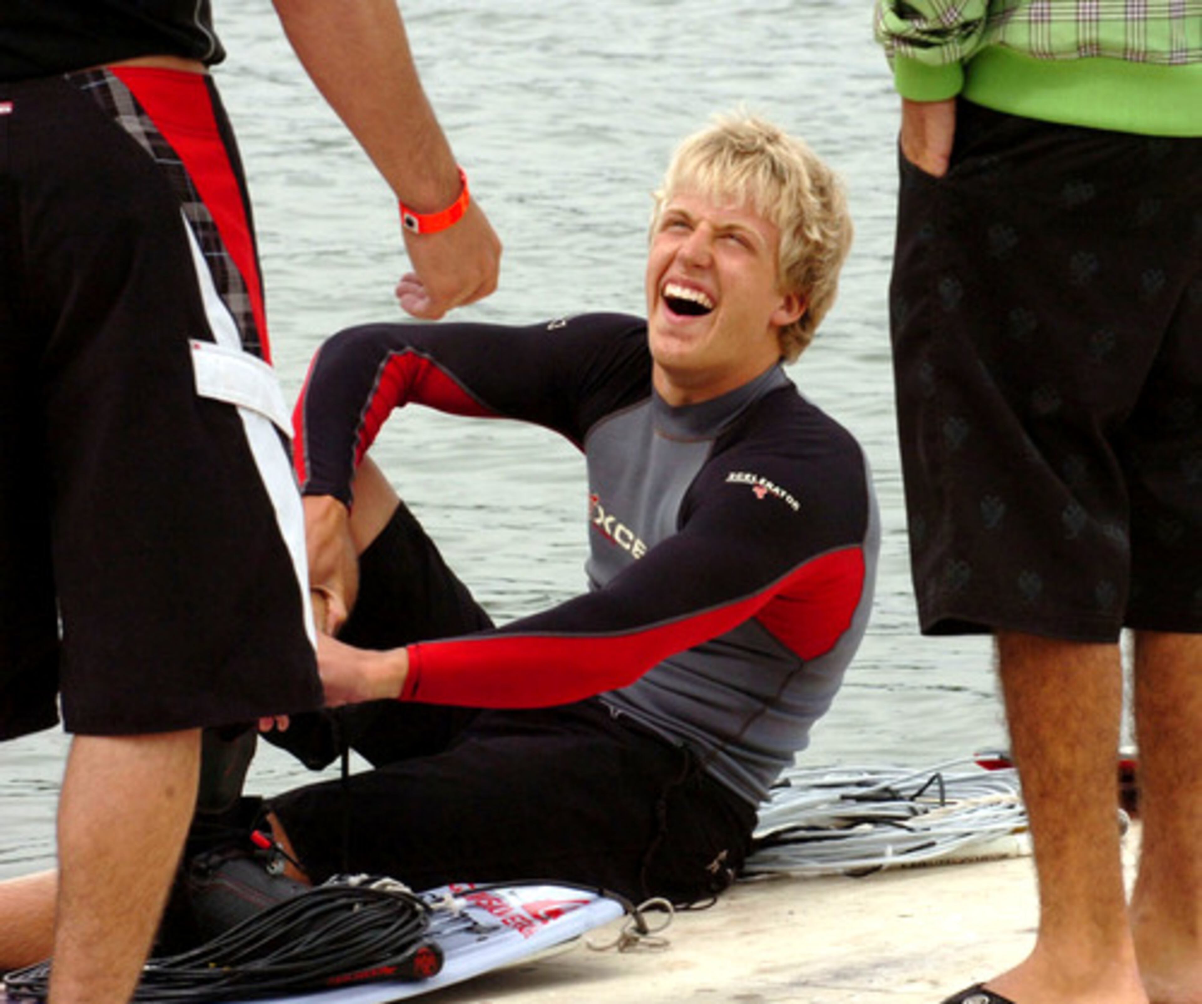 Johnny Tobaben, 16, who lives part of the year in Buford and part in Orlando (to train with his coach), jokes with other athletes before his turn in the junior men's division. Wakeboarding, which began during the 1980s, bills itself as the fastest-growing board sport in the world, beating out skateboarding, surfboarding and snowboarding.
