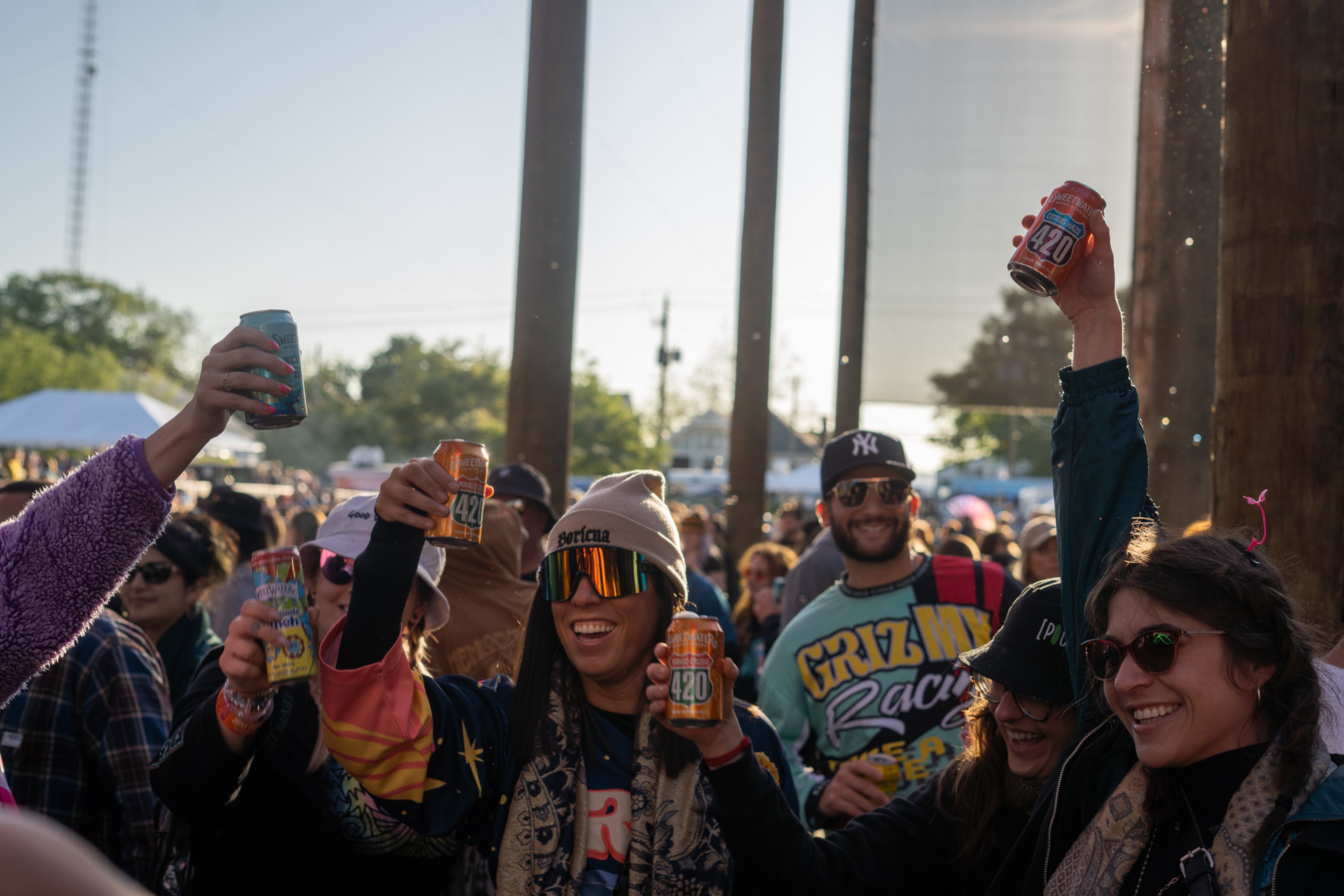 Festivalgoers hoist cold beers at SweetWater 420 Fest. (Courtesy of SweetWater Brewing Company)