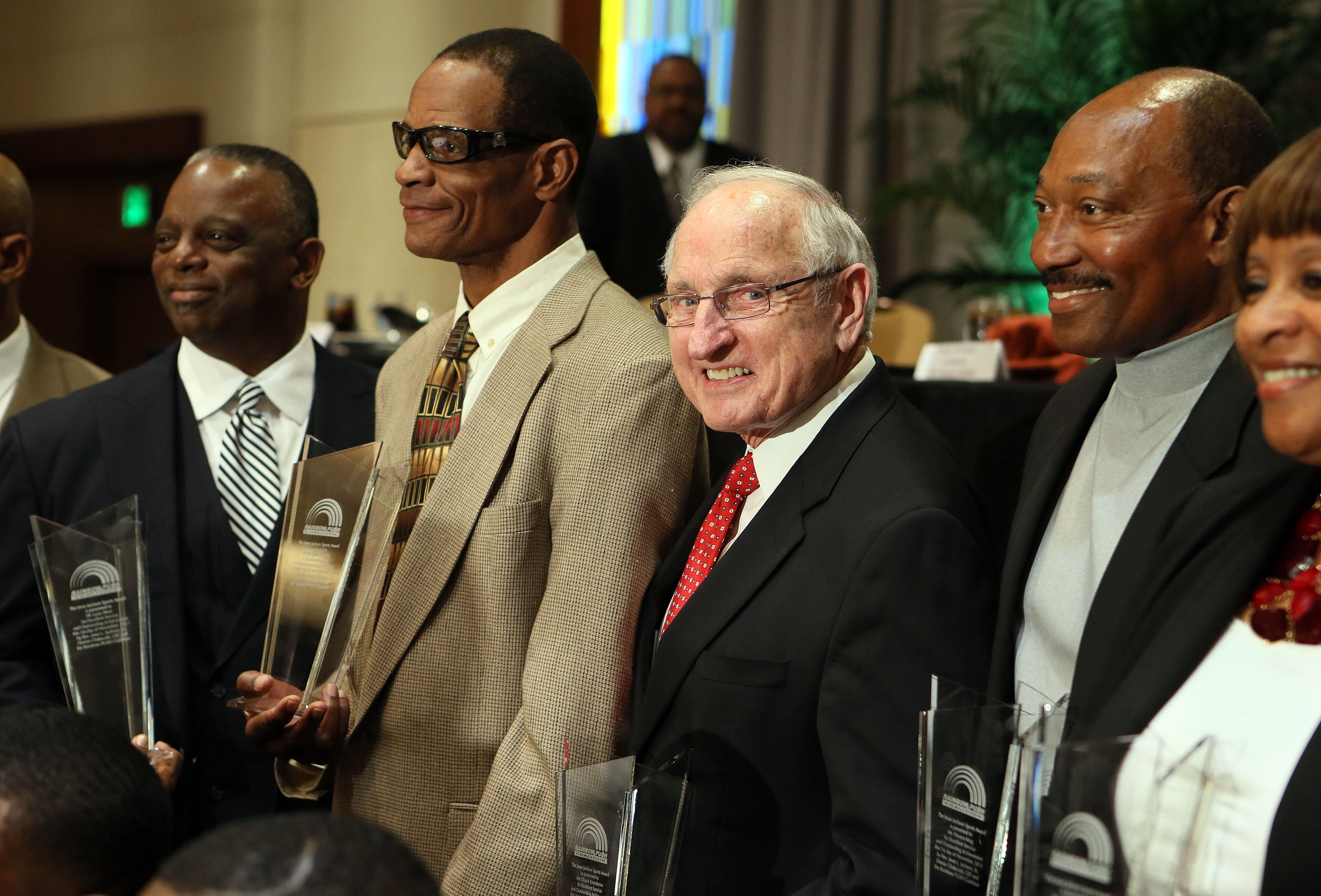 Larry West, Richard Appleby, former coach Vince Dooley and Horace King receive their awards during a ceremony where the Rainbow PUSH Coalition honored five alumni of the University of Georgia who were the first black students to play football on scholarship at the institution during the Sports Awards Luncheon and Youth Talent Showcase at the Hyatt Regency in Atlanta on Saturday November 2nd, 2013.