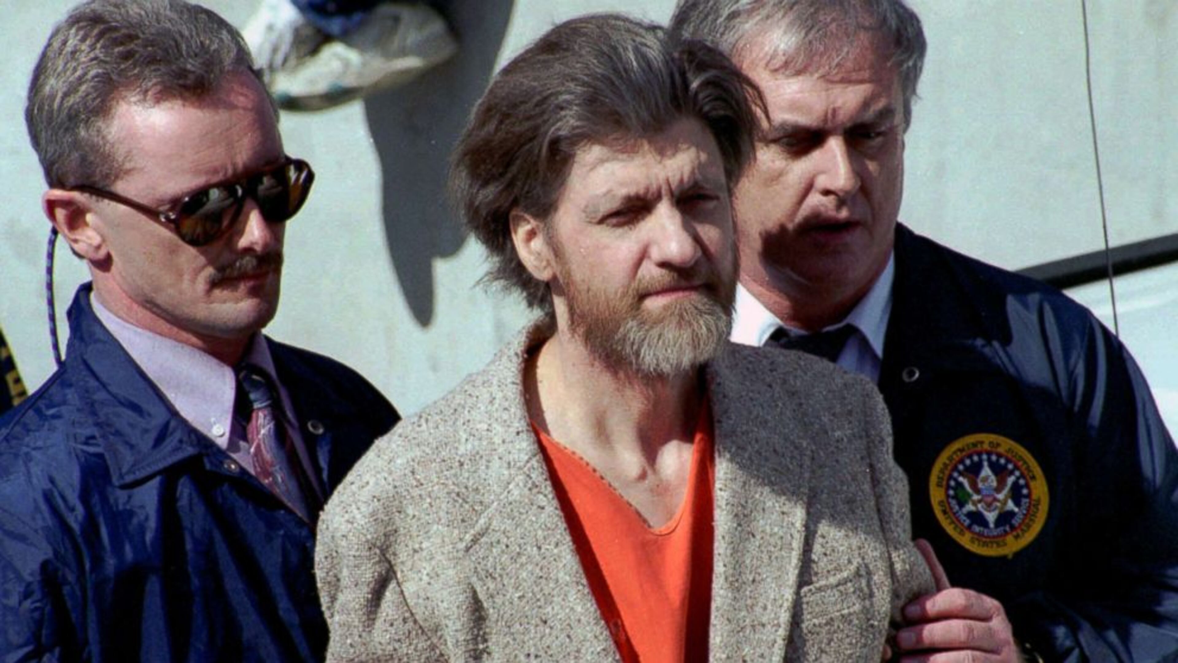 Ted Kaczynski is flanked by federal agents as he is led to a car from the federal courthouse in Helena, Montana on April 4, 1996. Kaczynski, who came to be known as the Unabomber, was arguably the most elusive suspect in the history of American criminal justice. Kaczynski, who tested the stamina of the FBI in one of the longest and expensive manhunts ever known, was captured on April 3, 1996 — 25 years ago today.